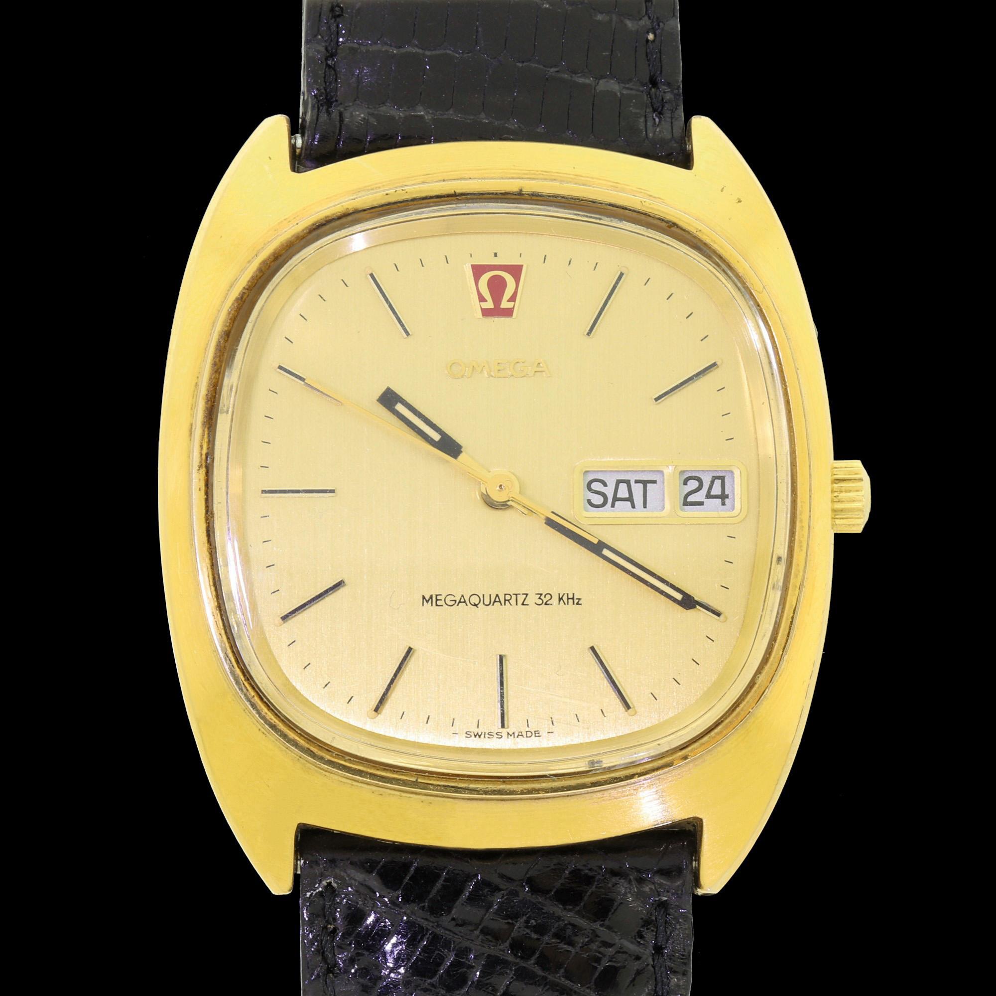 An extremely smart gentleman's Omega wristwatch. A richly gold-plated steel Megaquartz 32KHz Day Date model from 1972, using the 8 Jewel Omega Calibre 1310, Omega's first in-house Quartz movement. 
This lovely watch is set in a barrel / tv gold tone