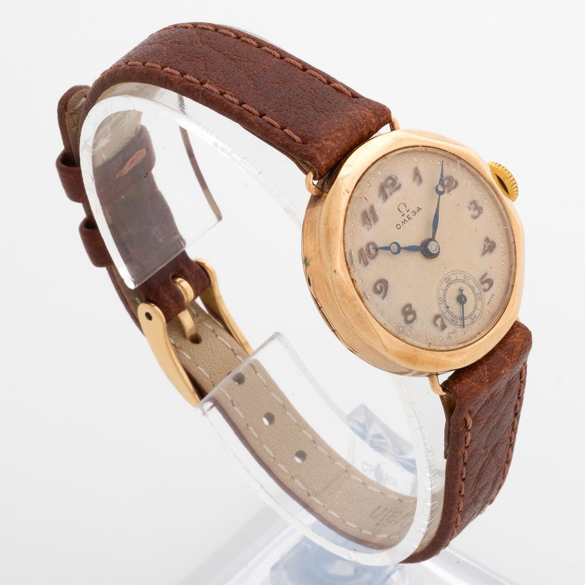 Our very attractive vintage Omega features a 9k gold case made by Dennison, with manually wound 15 jewel movement, and very attractive patinated dial with arabic Numerals and sub seconds dial. The case measures 27.4mm inc crown x 29mm fixed lug to