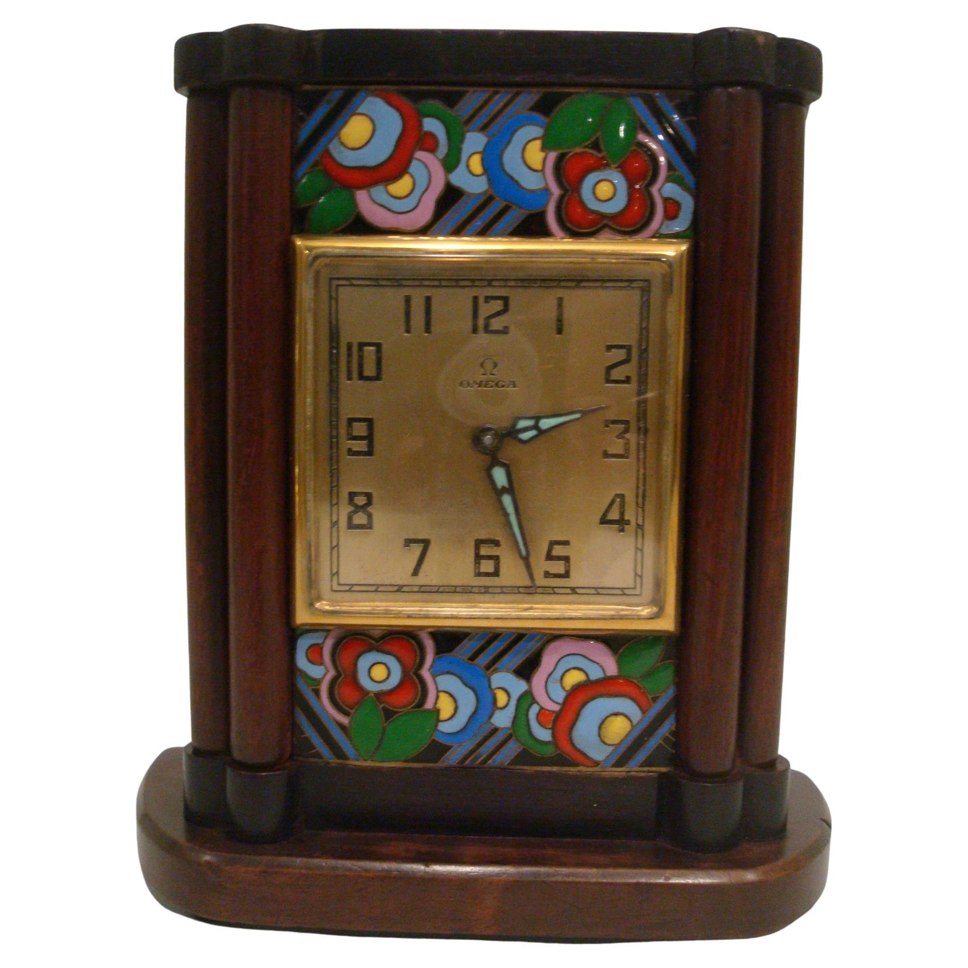 Omega, a Wood and Enamel Art Deco Eight Day Desk Clock For Sale