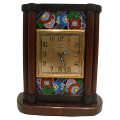Omega, a Wood and Enamel Art Deco Eight Day Desk Clock