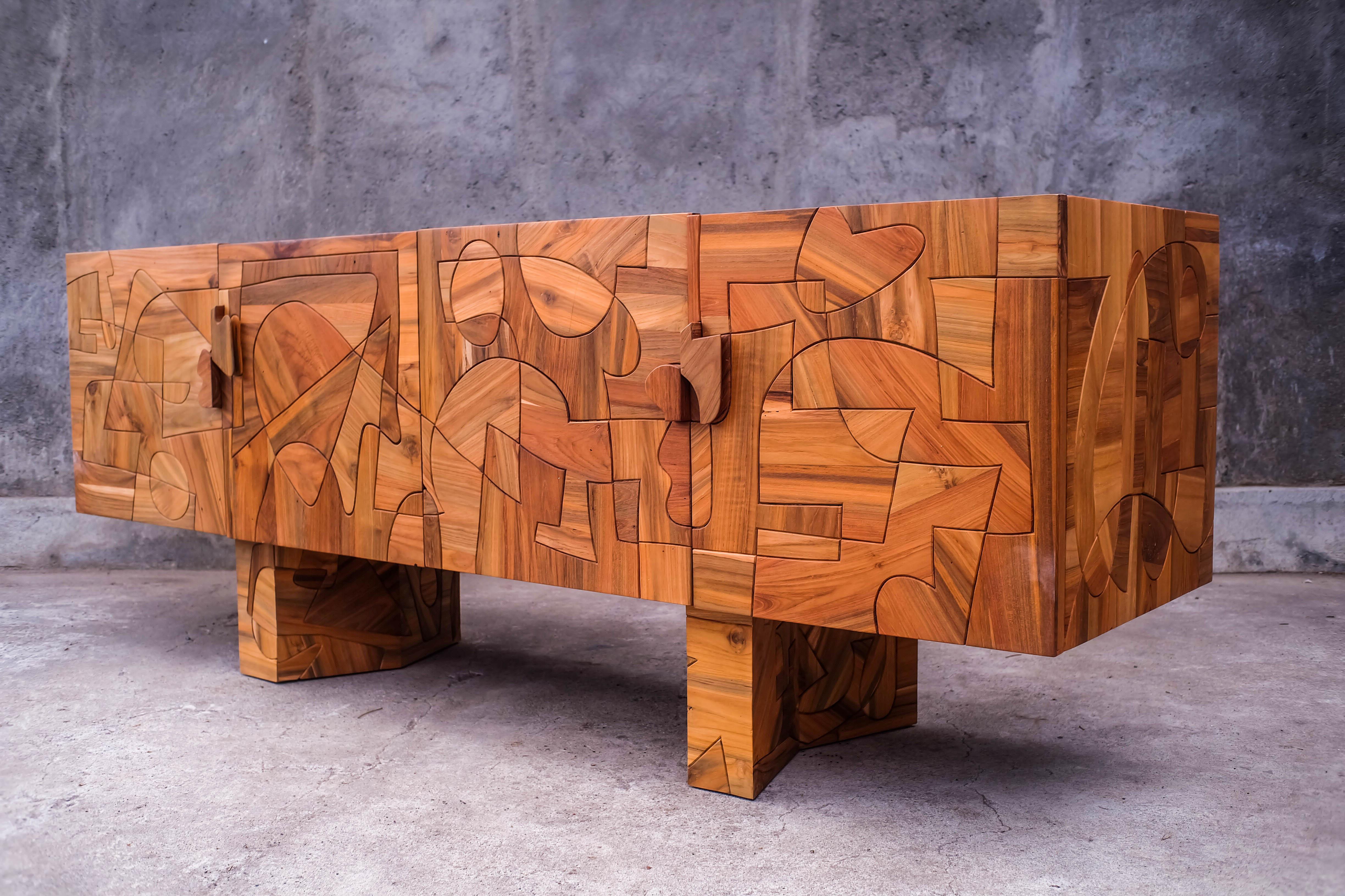 This exclusive sideboard is hand made of vintage teak wood, been carefully selected and then shaped by Felix de Boussy to make a stunning wooden sideboard. A unique piece of work, sculptured, and one of a kind. 

  