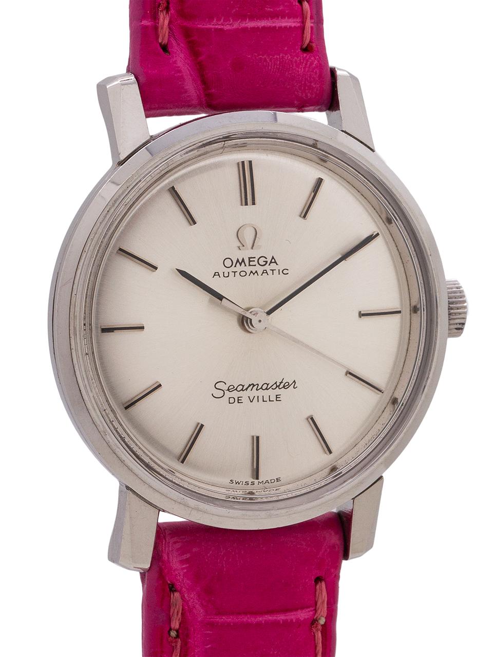 
Omega Lady’s automatic Deville stainless steel ref 165.016 circa 1966. Featuring a 28mm case with short lugs and Seamaster case back, and with original silver satin dial with applied silver indexes, applied Omega logo and silver baton hands.