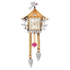 Vintage Omega Birdhouse brooch in 14k gold and diamonds
