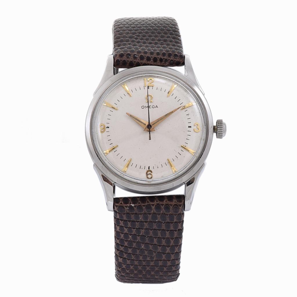 Step into a world of timeless elegance with the OMEGA Reference 2635 Vintage 1960's watch, a true testament to sophistication and luxury. This exceptional timepiece boasts a 34mm round stainless steel case, combining classic design with durability
