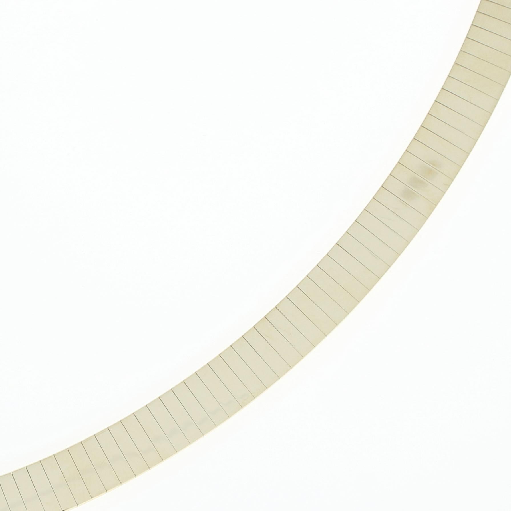 Go from the workweek to the weekend in style! Created in Italy, this gorgeous 14k yellow gold omega chain necklace features a classic choker length for versatility in your wardrobe and a smooth, highly reflective finish for an elegant presentation