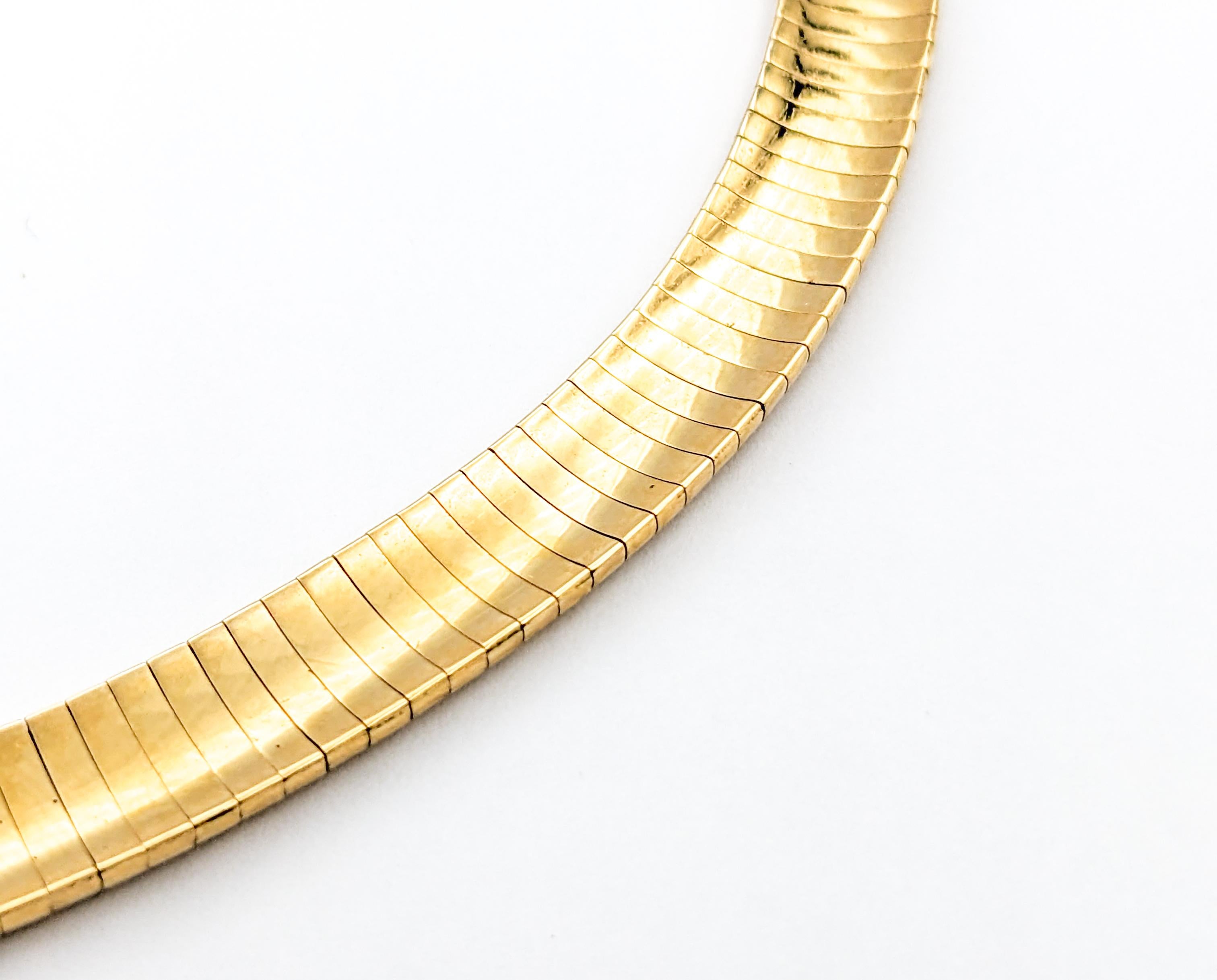 Omega Chain In Yellow Gold

Introducing an exquisite gold fashion necklace crafted in 14kt yellow gold. This elegant piece features an Omega chain, known for its sleek and sophisticated design. The necklace measures 17 inches in length and is 8mm