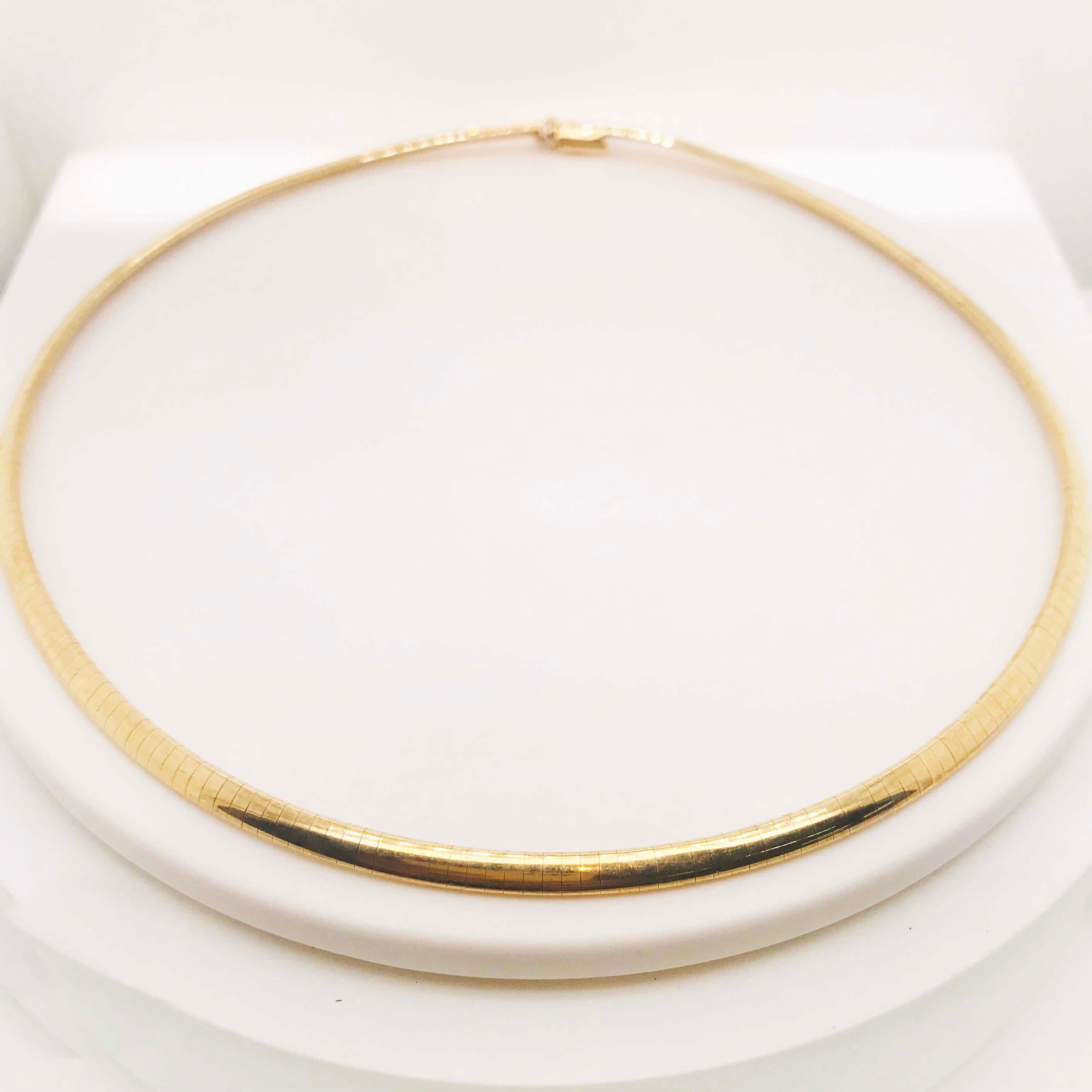 This solid gold Omega choker necklace is timeless! The smooth chain has curved links that fit together perfectly like a puzzle. The choker necklace sits flat on your necklace and is so high fashion! The high polish gold has a butter-smooth texture