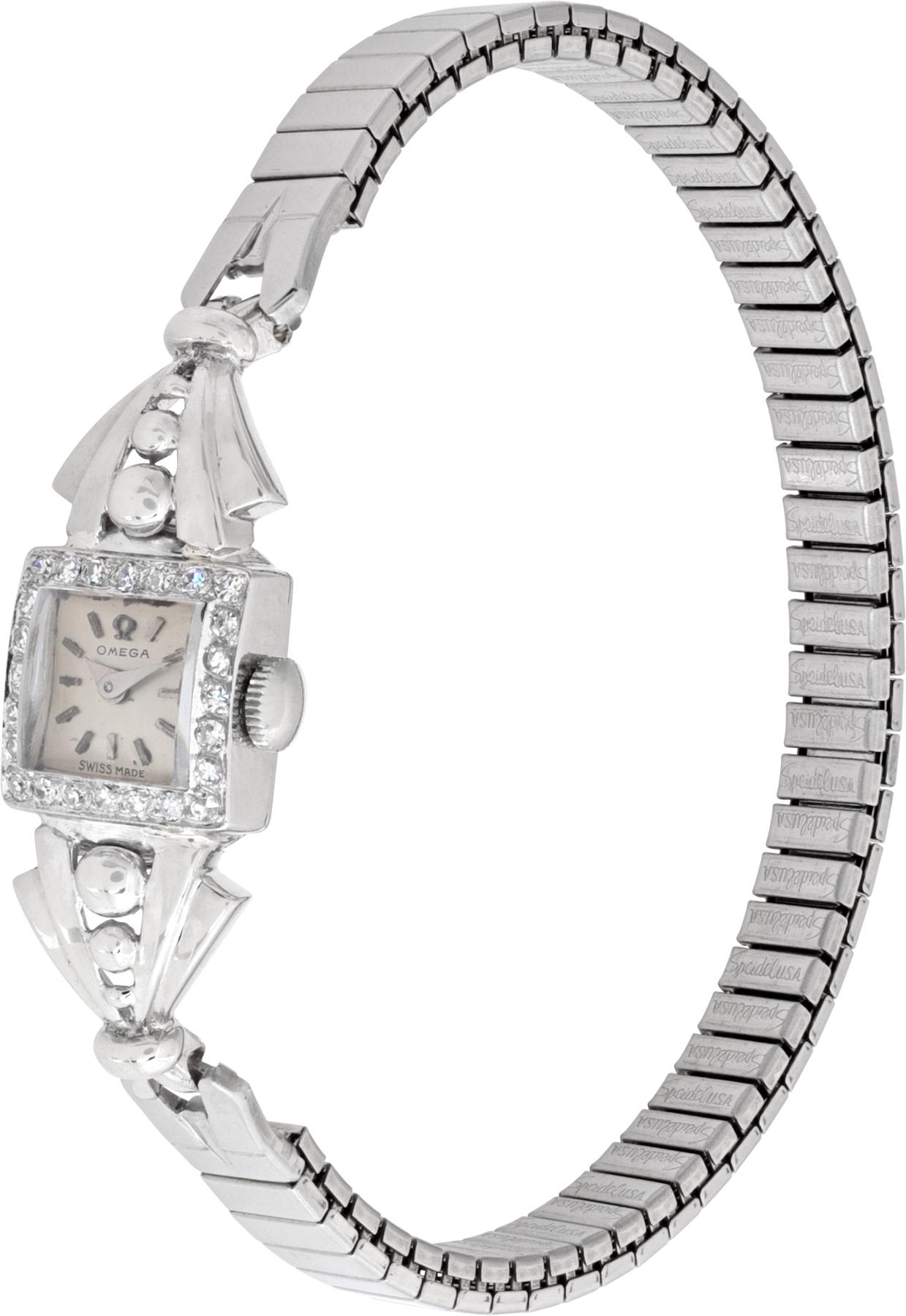 Art Deco cocktail Omega classic watch in platinum on a spidel stainless steel bracelet 13 mm case size. Ref 8007. Circa 1940s. Fine Pre-owned Omega Watch.

 Certified preowned Dress Omega Classic 8007 watch is made out of Platinum on a Stainless