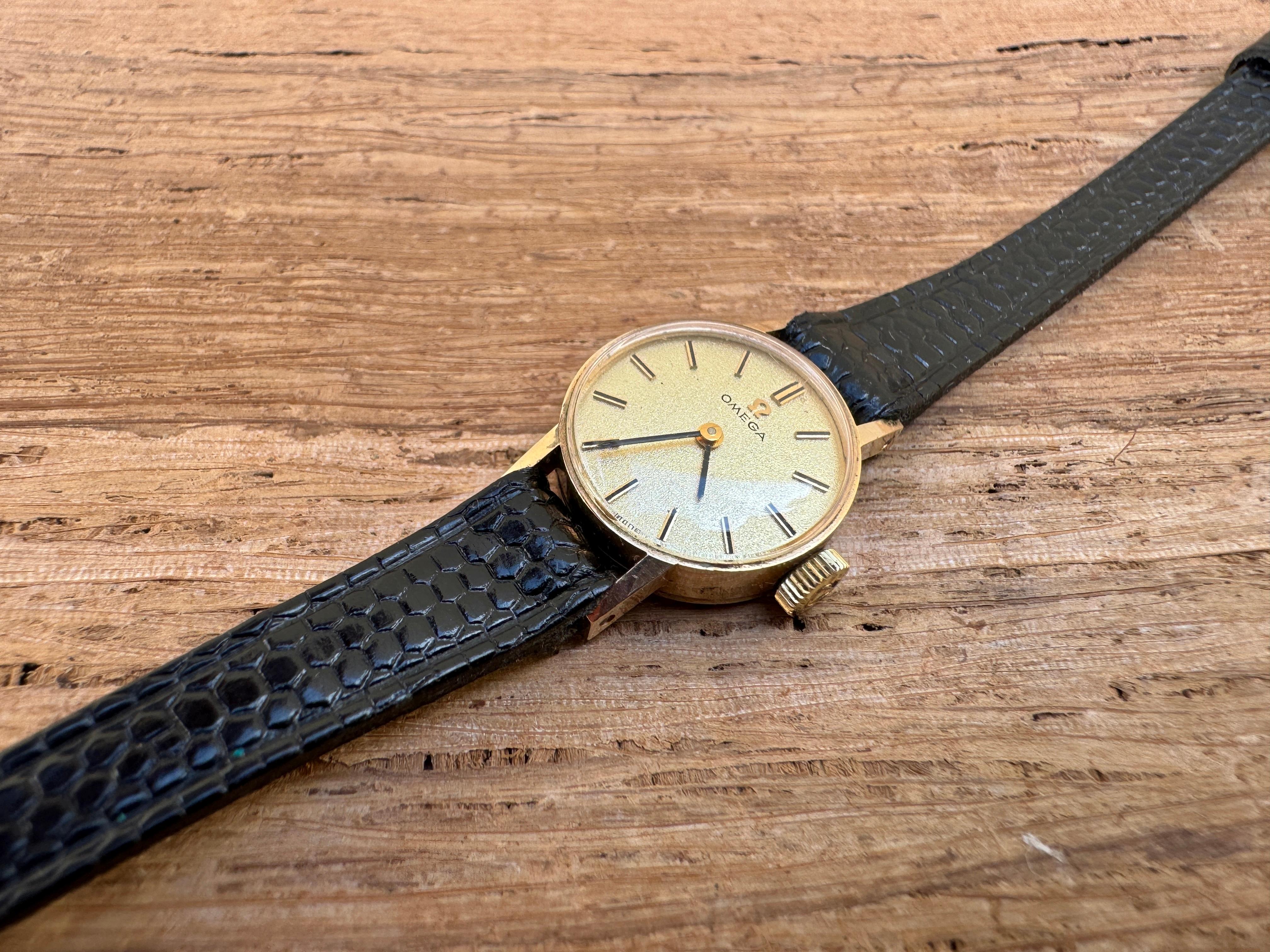  Description
Brand: Omega

Model: 1061

Reference Number: 5115642

Country Of Manufacture: Switzerland

Movement: Hand Winding

Case Material: 9k Gold

Measurements : Case width: 17 mm (without crown)

Band Type : Black Leather With Marked
