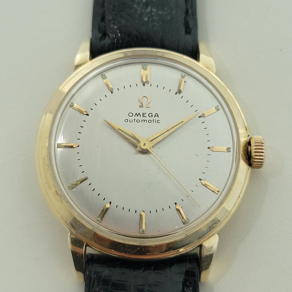 Luxurious classic, Men's Omega US Collection GX 6525 14k solid gold automatic, c.1956, in excellent working condition. Verified authentic by a master watchmaker. Gorgeous Omega signed dial, applied baton index hour markers, gilt minute and hour