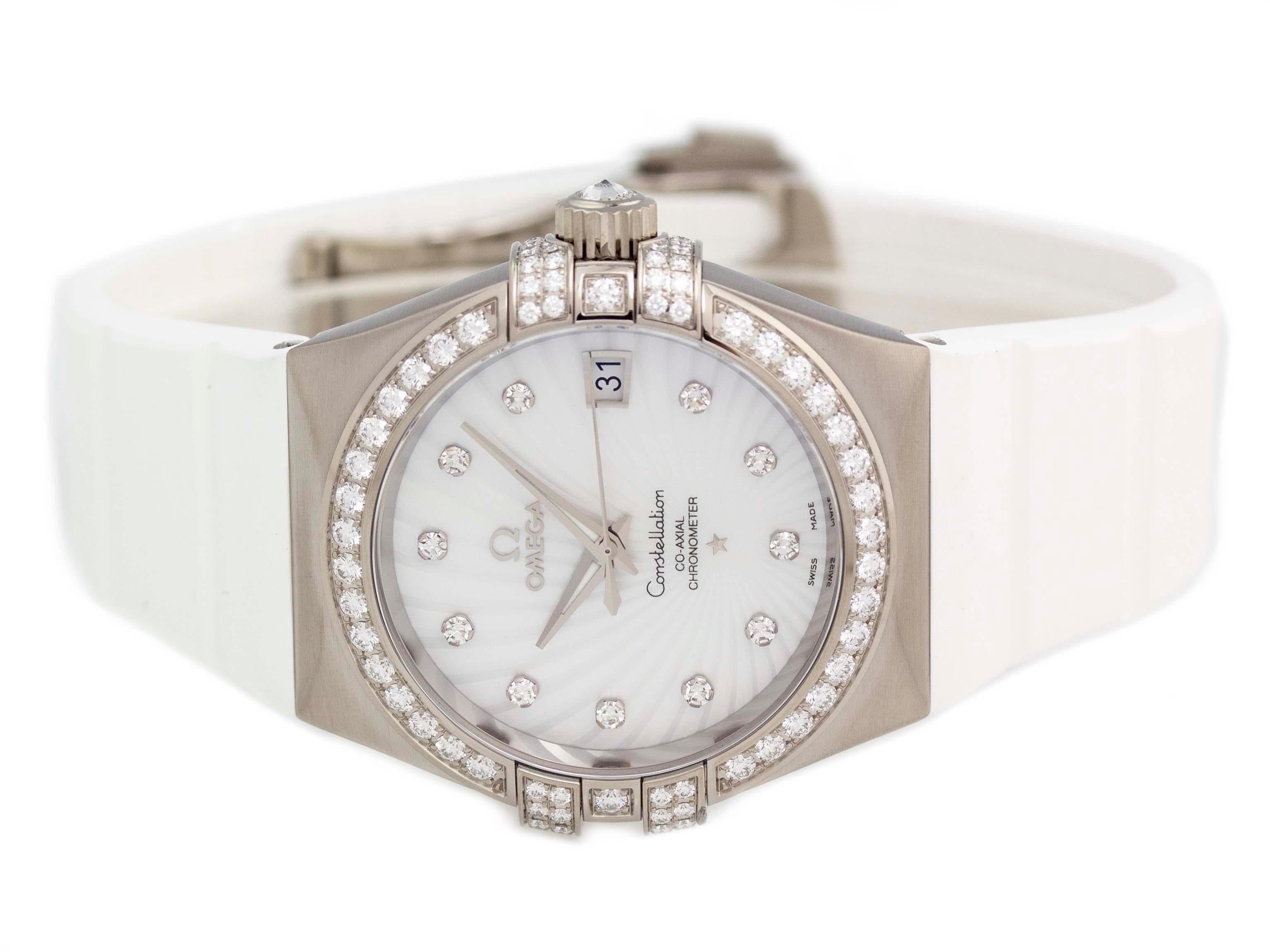 Brand	Omega
Series	Constellation Co-Axial
Model	123.57.35.20.55.005
Gender	Ladies
Condition	Excellent Display Model
Material	18k White Gold
Finish	Brushed
Caseback	Transparent
Diameter	35mm
Thickness	 11mm
Bezel	Diamond Set
Crystal	Anti-Reflective