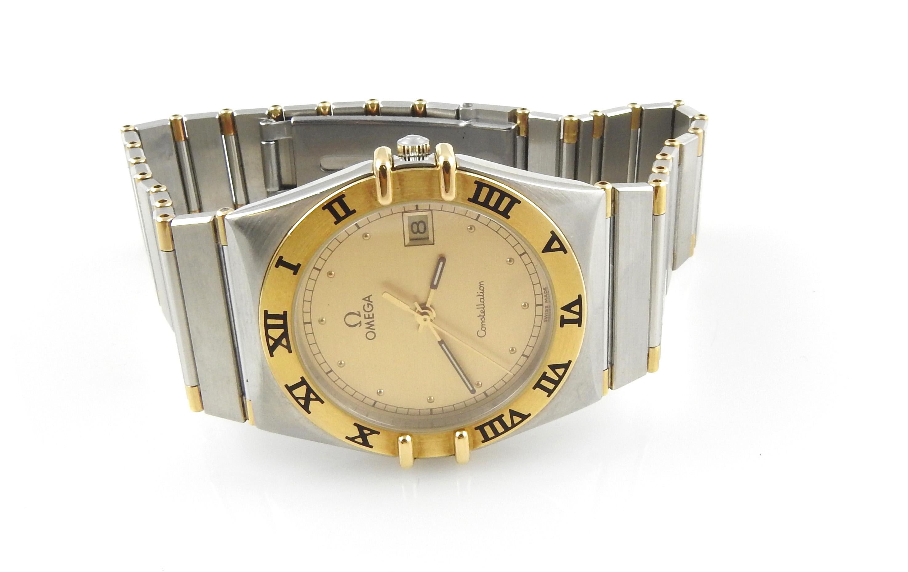 Omega Constellation Men's Watch

This classic men's watch is set in 18K yellow gold and stainless steel.

Stainless steel band has 18K gold half bars.  - fits up to 7.5