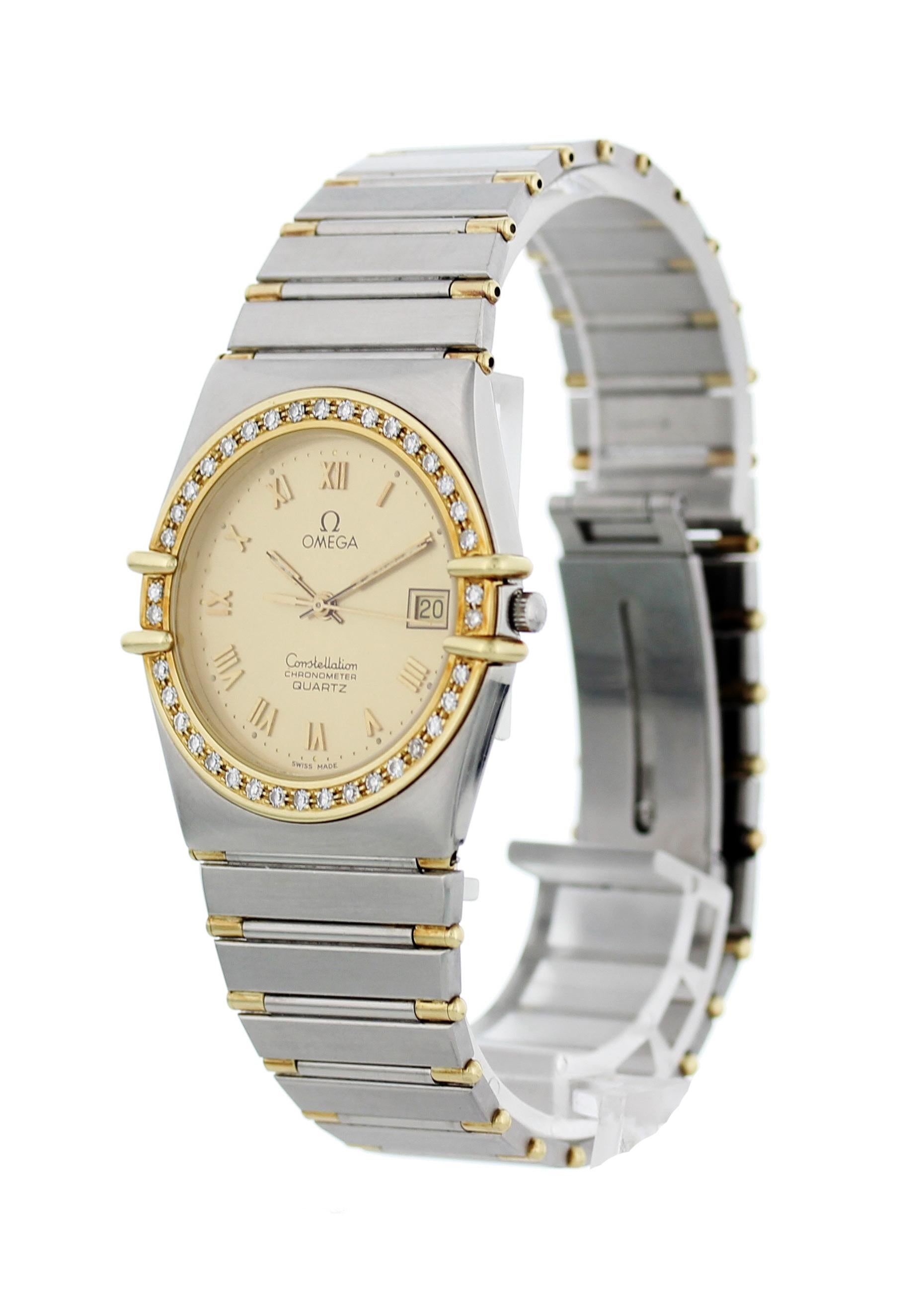 Omega Constellation. Stainless steel 32 mm case. 18k yellow gold Diamond bezel. Champagne dial with gold luminous hands and gold Roman numerals. Date display. Stainless steel and Yellow gold band with push button sliding clasp; will fit up to a 7.5