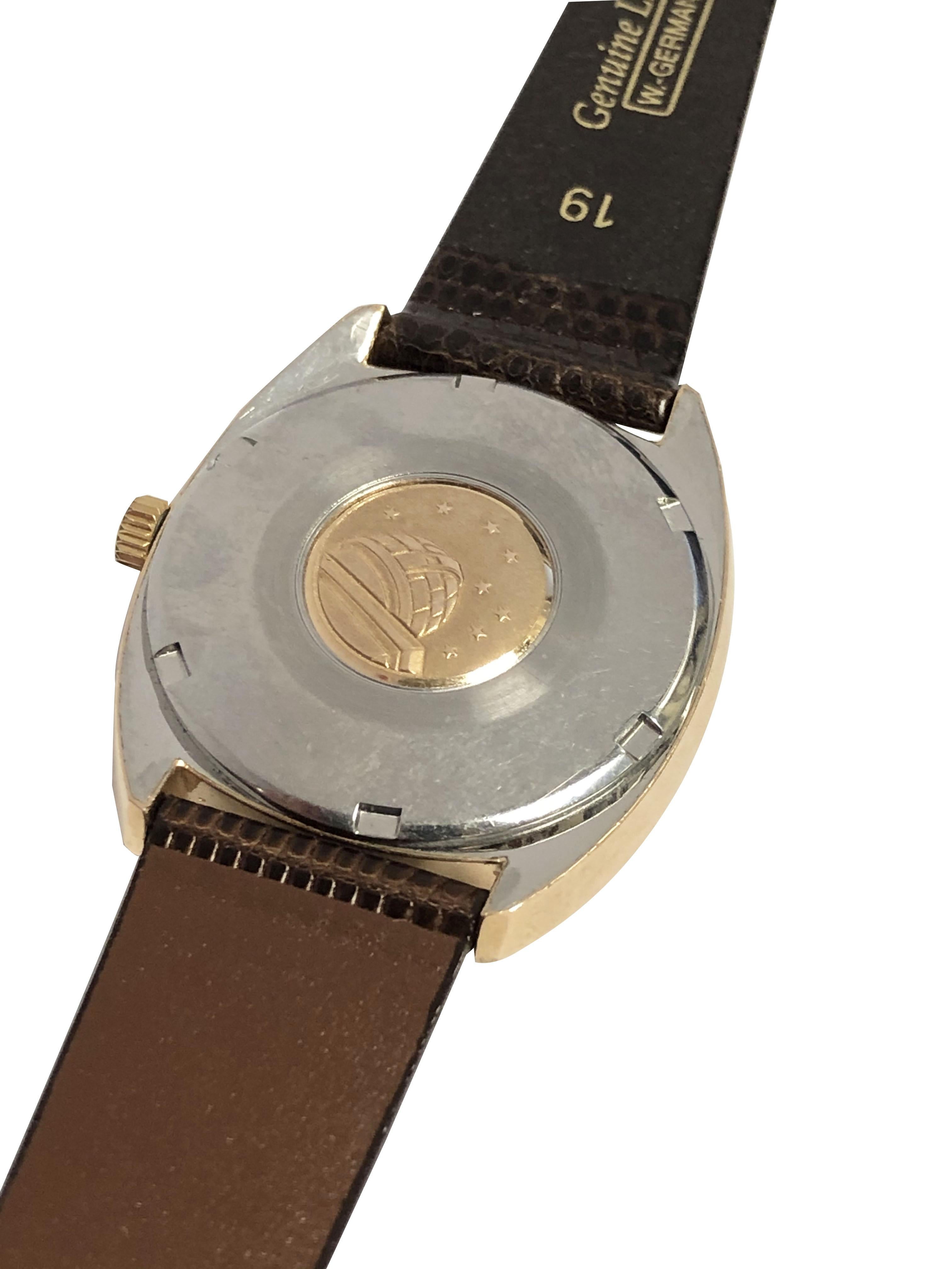 Circa late 1960s Omega Constellation Wrist Watch, 34 M.M. Barrel shape 2 Piece water Proof Rose Gold Shell case with Fluted Bezel and Steel back with Rose Gold Observatory emblem. Automatic self winding movement, Original, Excellent, Mint condition