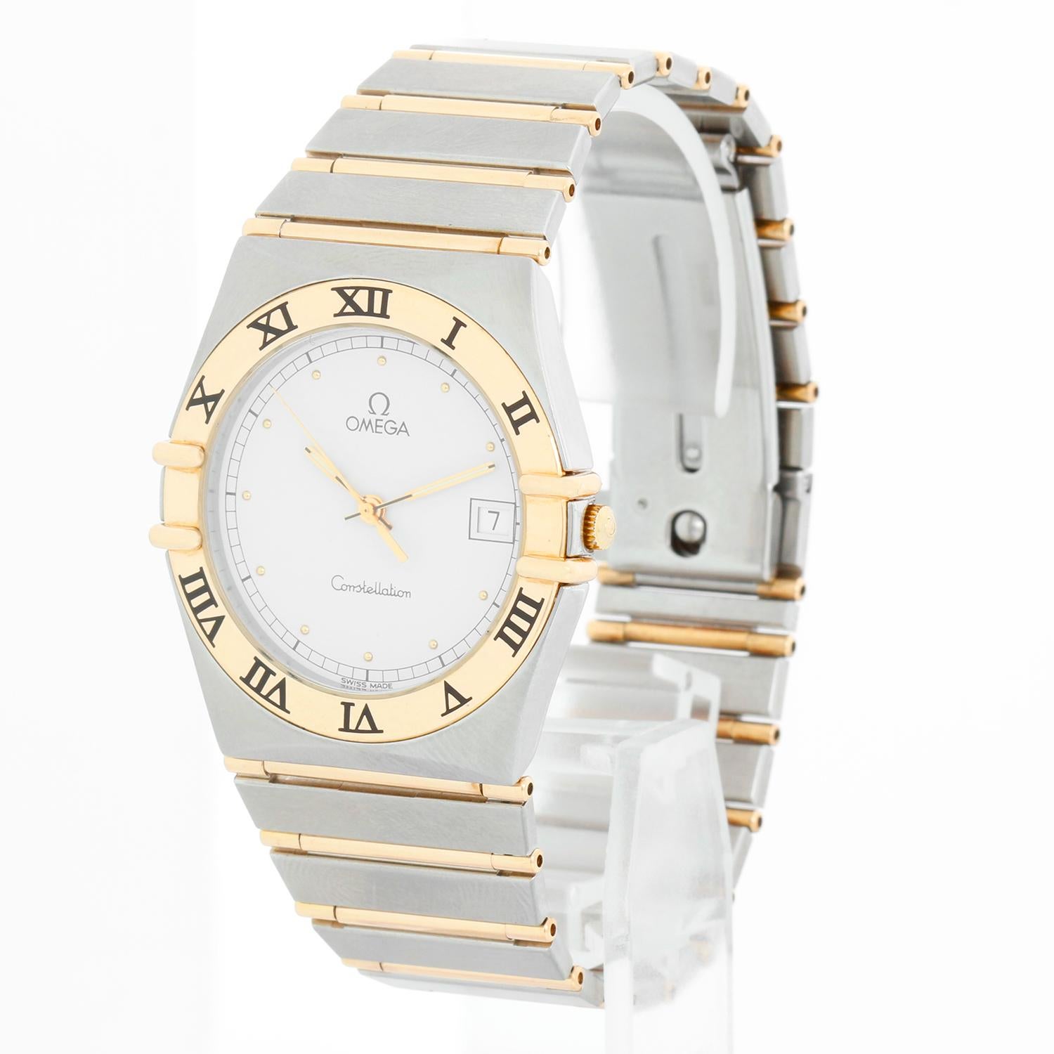 Omega Constellation 2-Tone Men's Quartz Watch - Quartz. Stainless steel with 18K yellow gold fixed bezel  (33mm). White dial with luminous hands; date at 3 o'clock. Stainless steel deployment buckle clasp; will fit a 7.5 inch wrist . Pre-owned with