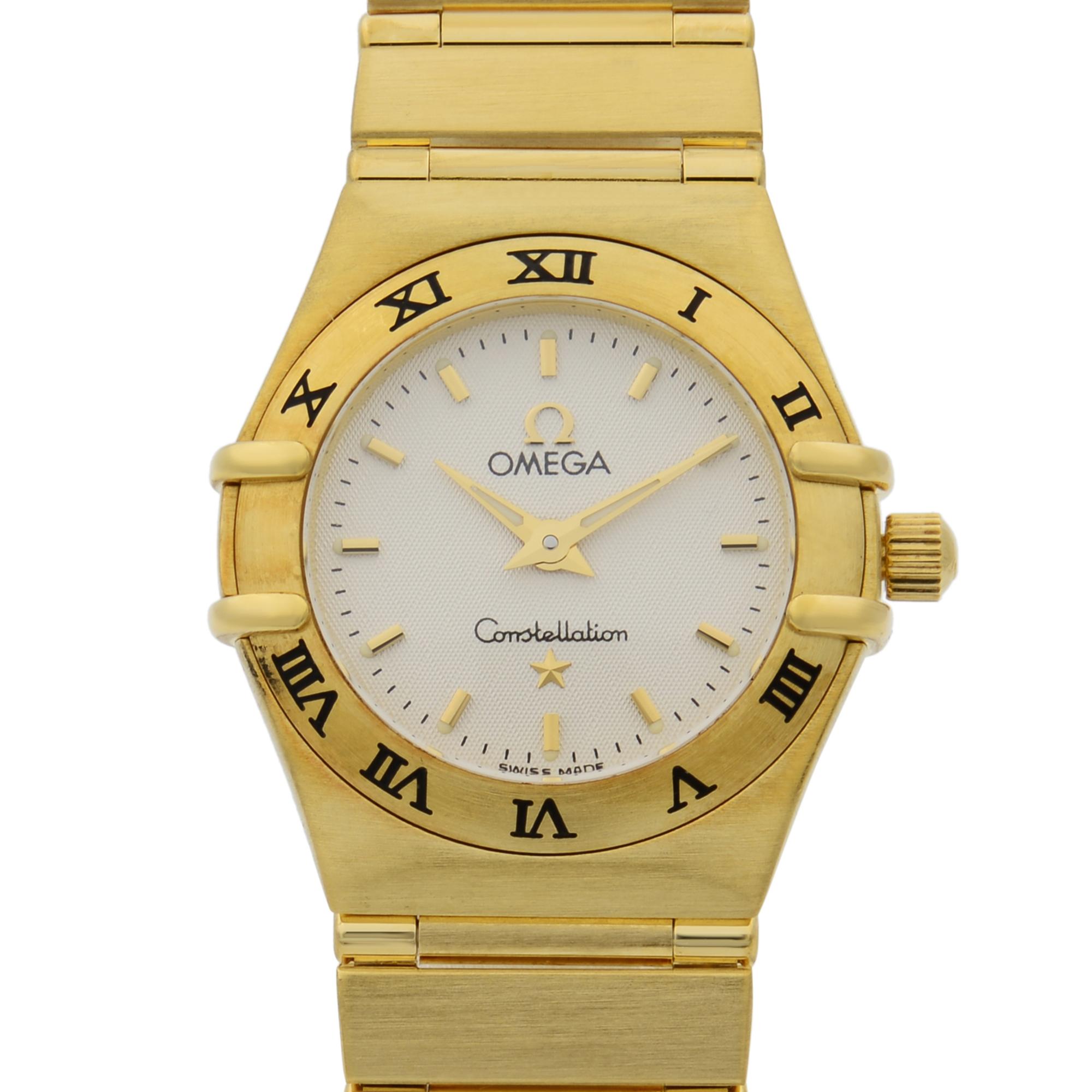 This pre-owned Omega Constellation  is a beautiful Ladie's timepiece that is powered by quartz (battery) movement which is cased in a yellow gold case. It has a round shape face, no features dial and has hand sticks style markers. It is completed
