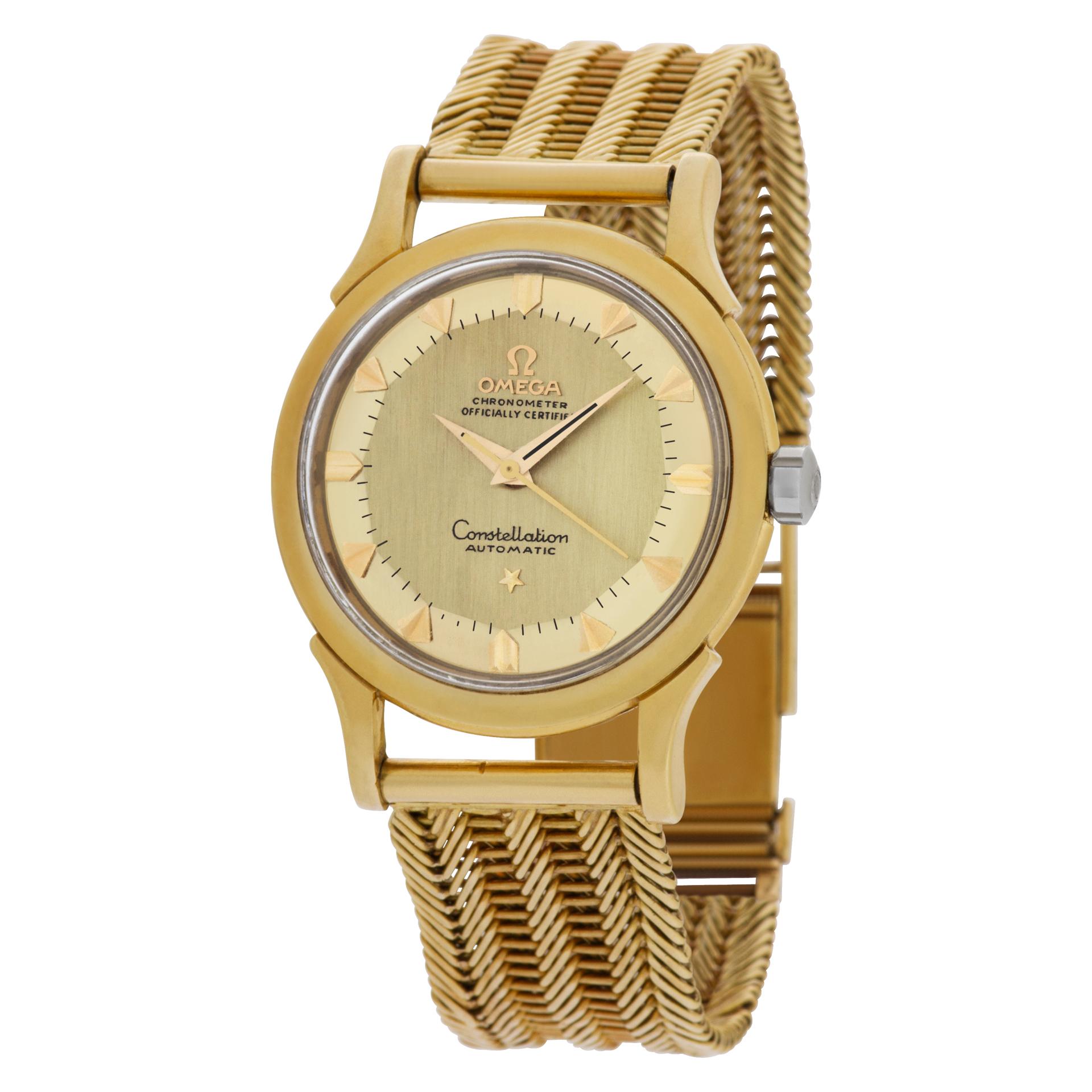 Vintage Omega Constellation in 18k with a custom 18k mesh bracelet. 24 jewel automatic movement. 35 mm case size. Fits maximum 7 inches wrist. Ref 2852/2853. Circa 1958. Fine Pre-owned Omega Watch. Certified preowned Classic Omega Constellation