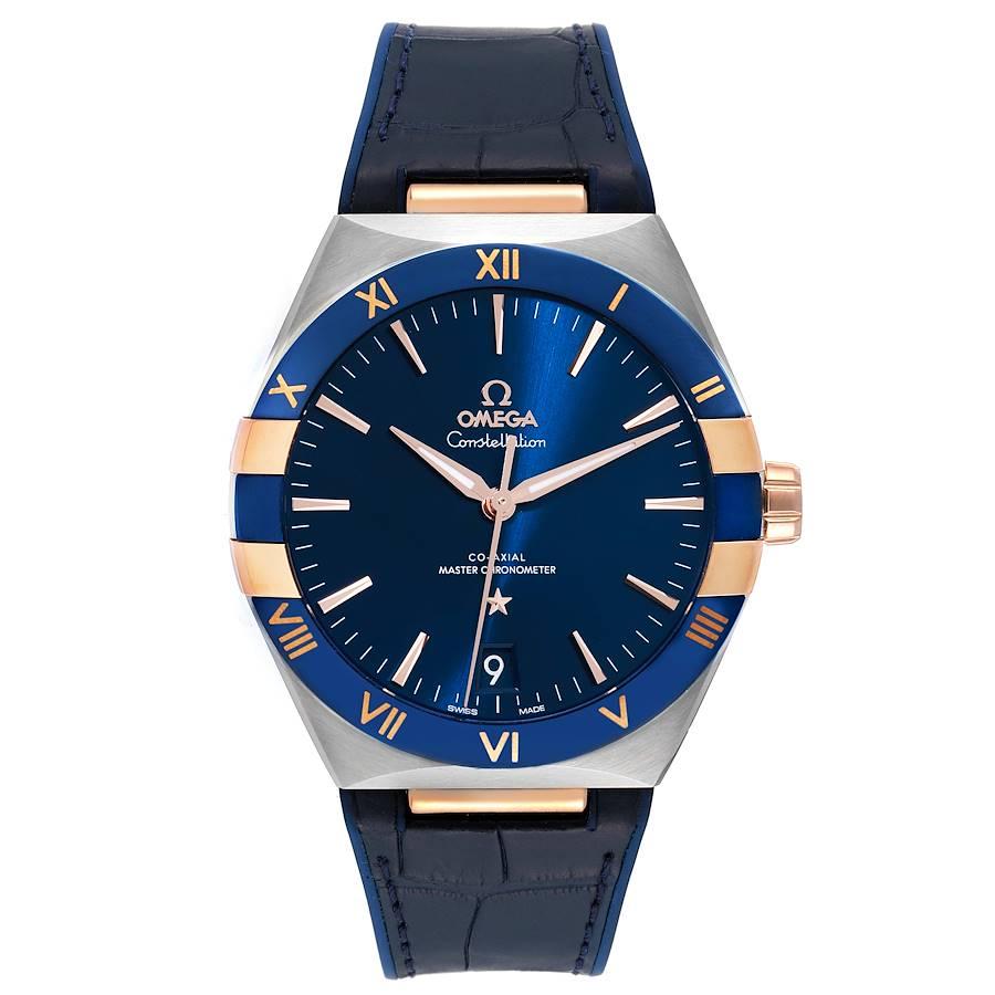 Omega Constellation 41mm Steel Rose Gold Mens Watch 131.23.41.21.03.001 Box Card. Automatic self-winding Co-Axial Escapemen movement. Stainless steel case 41.0 mm in diameter. Omega logo on a 18k rose gold crown. Blue ceramic bezel with rose gold