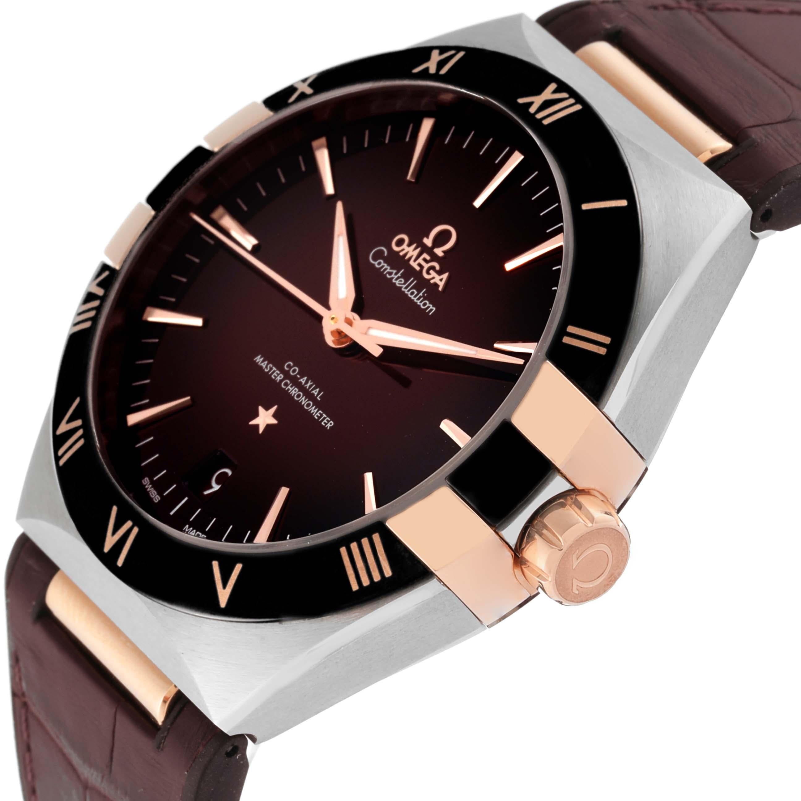 Omega Constellation 41mm Steel Rose Gold Mens Watch 131.23.41.21.11.001 Unworn. Automatic self-winding Co-Axial Escapement movement. Stainless steel case 41.0 mm in diameter. Omega logo on an 18k rose gold crown. Black ceramic bezel with rose gold