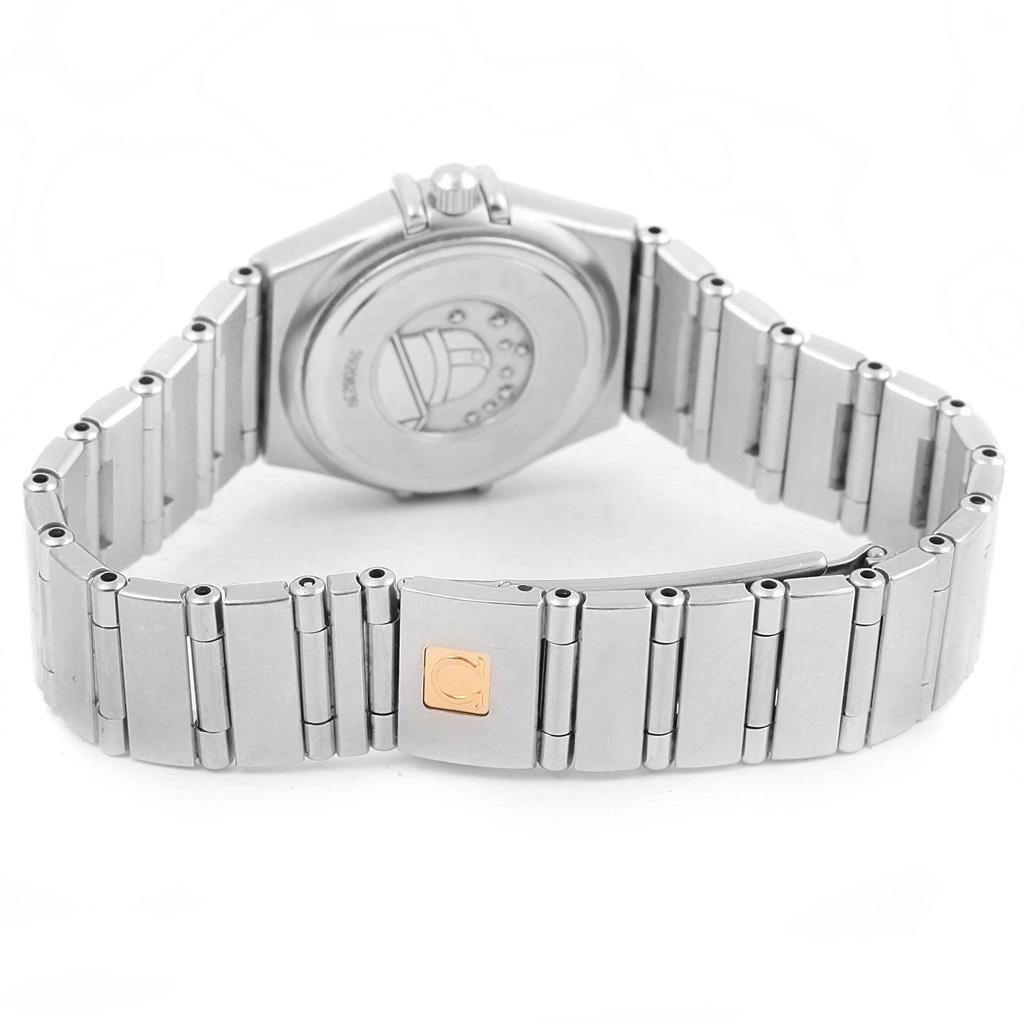 Omega Constellation 95 Mini Diamond Ladies Watch 1460.75.00. Quartz movement. Stainless steel round case 22.5 mm in diameter. Diamond bezel. Scratch resistant sapphire crystal. Mother-of-pearl Omega logo dial with diamond hour markers. Stainless