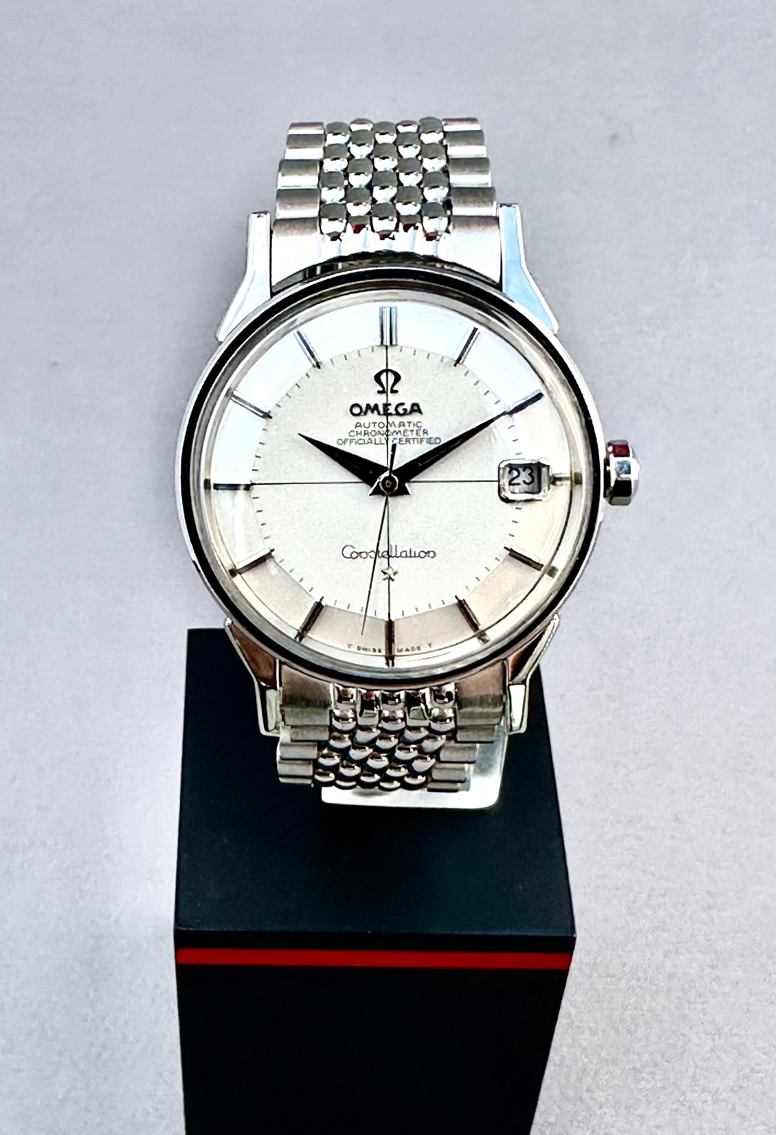 Omega Constellation Pie Pan Automatic
This vintage Omega Constellation ‘Pie-Pan’ stainless steel wristwatch on Original Rice Bracelet
Circa 1962 and is in overall Excellent Condition as it is Recently Serviced.
Original White dial with Silver Batons