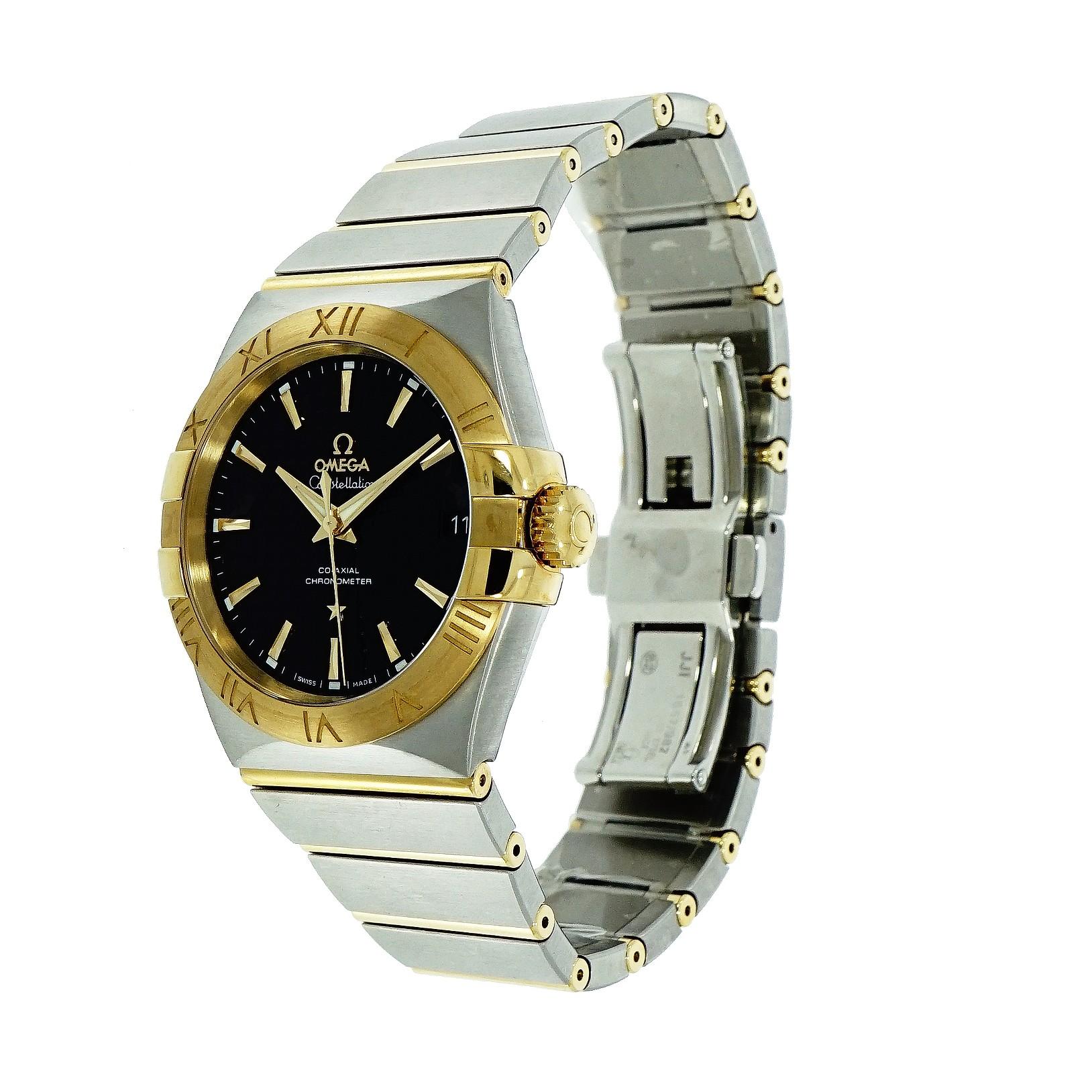 Omega Constellation, 38 mm stainless steel case, fixed  Yellow gold bezel with roman numerals, automatic co-axial movement caliber 8500, 39 jewels, screw down crown, sapphire crystal, black  waffle dial with indexes hour markers, date display at 3