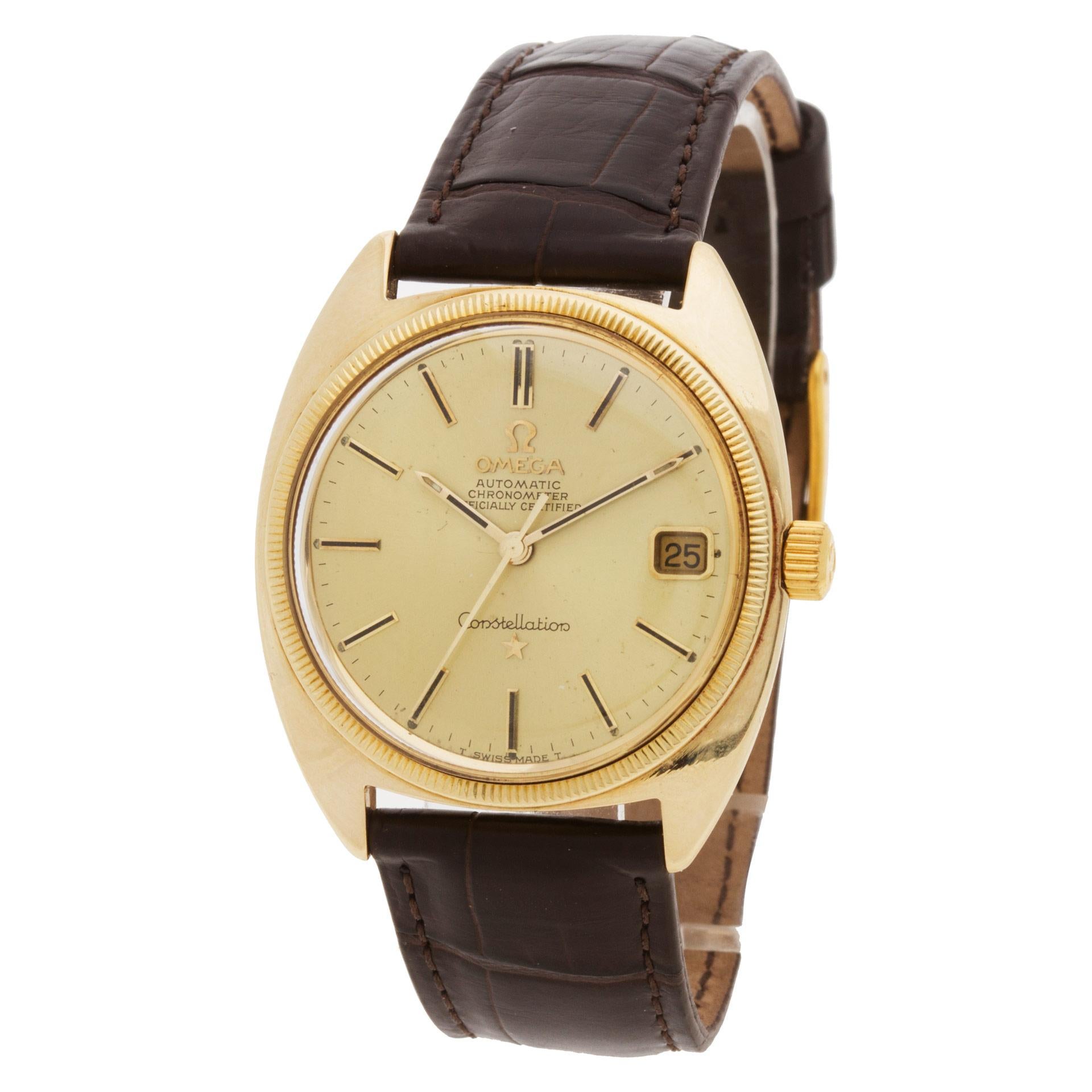 Omega Constellation in 14k on a brown alligator band. Auto w/ sweep seconds and date. 33 mm case size. Ref 168029. Circa 1970s. Fine Pre-owned Omega Watch.   Certified preowned Dress Omega Constellation watch is made out of yellow gold on a Brown