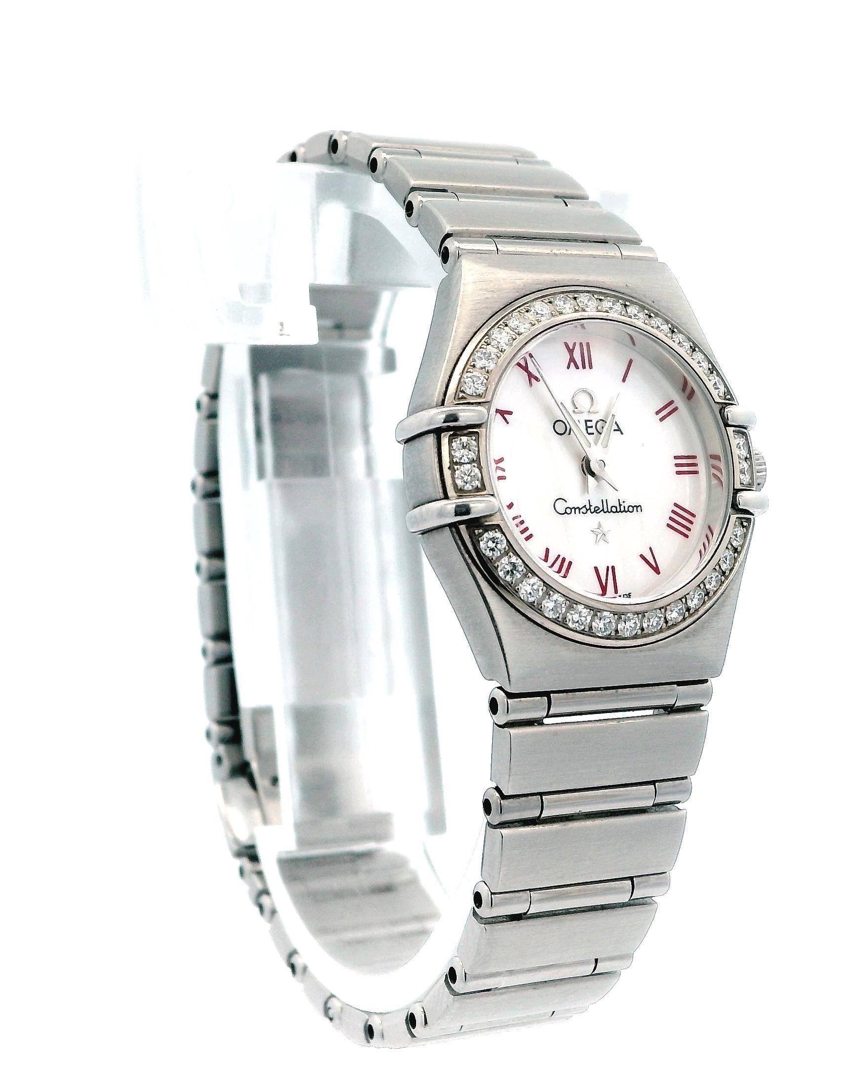 Pre-owned Omega Constellation Ladies Watch. Stainless steel 25mm case . Steel bezel with factory set diamonds. Mother of pearl dial with red roman numerals. Stainless steel band with a push button clasp. Will fit up to a 6 inch wrist. Sapphire