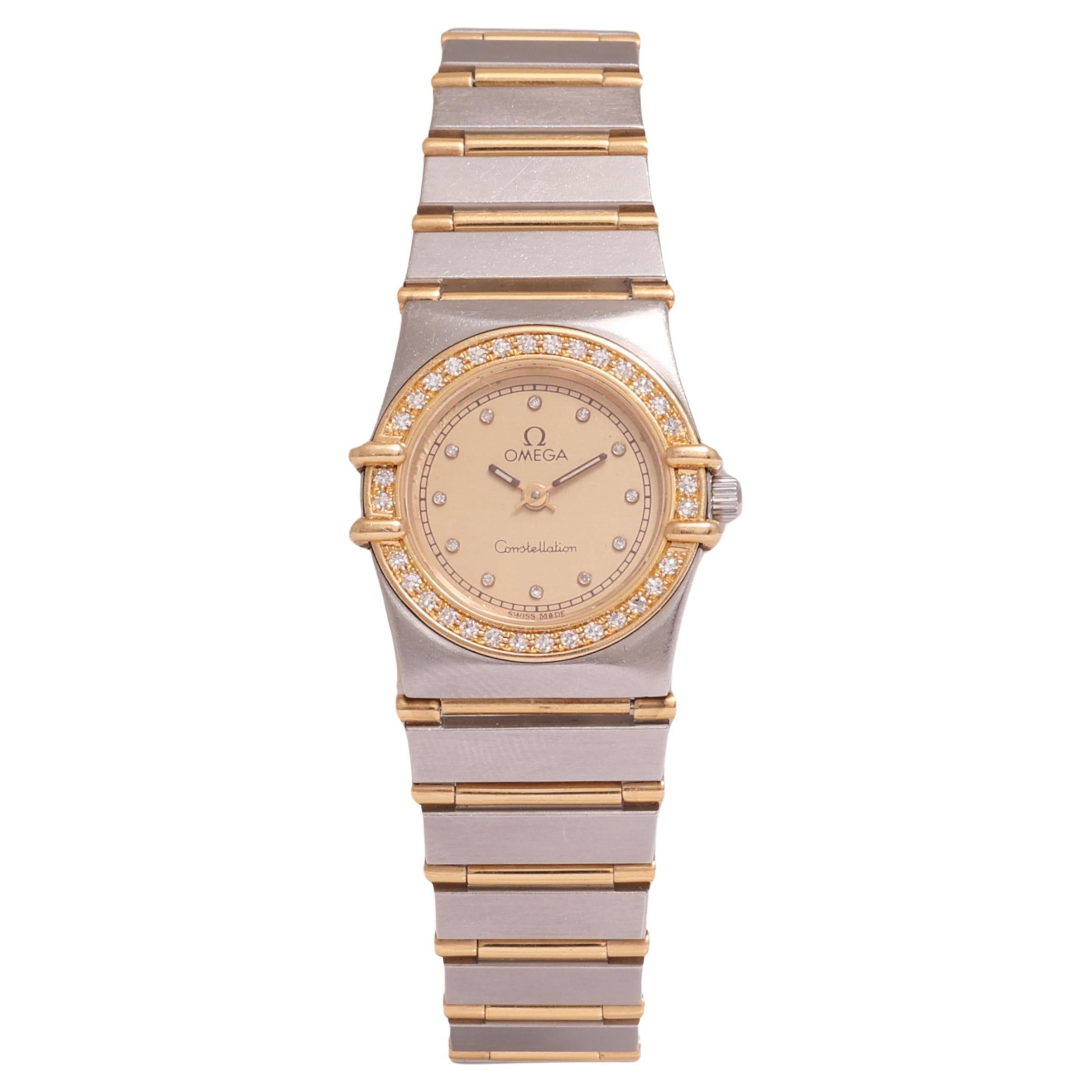 Omega Constellation Quartz Wristwatch, Gold & Steel, Diameter 24 mm

Model: Constellation quartz

Movement: Quartz

Case: Gold / Steel case, Diameter 24 mm, Thickness 5 mm, The case is fitted with an 18K yellow gold bezel set with diamonds, sapphire