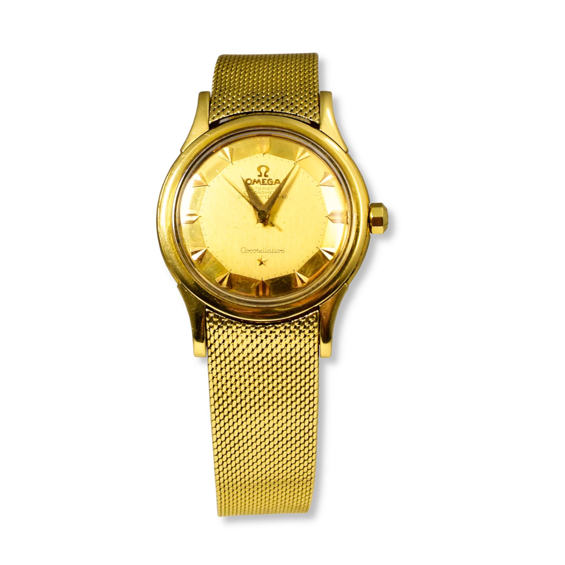 Brand: Omega
Model: Constellation
Ref: 168.005
Case Shape:  Round
Case Diameter: 34 mm
Dial Color: Gold
Movement: Automatic
Case Material: 18k Yellow Gold
Bracelet Material: Milanese Mesh Bracelet; 18k Yellow Gold
Functions: Date, Hour, Minute,