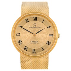 Omega Constellation vintage con caja, brazalete y esfera grabada, todo en oro