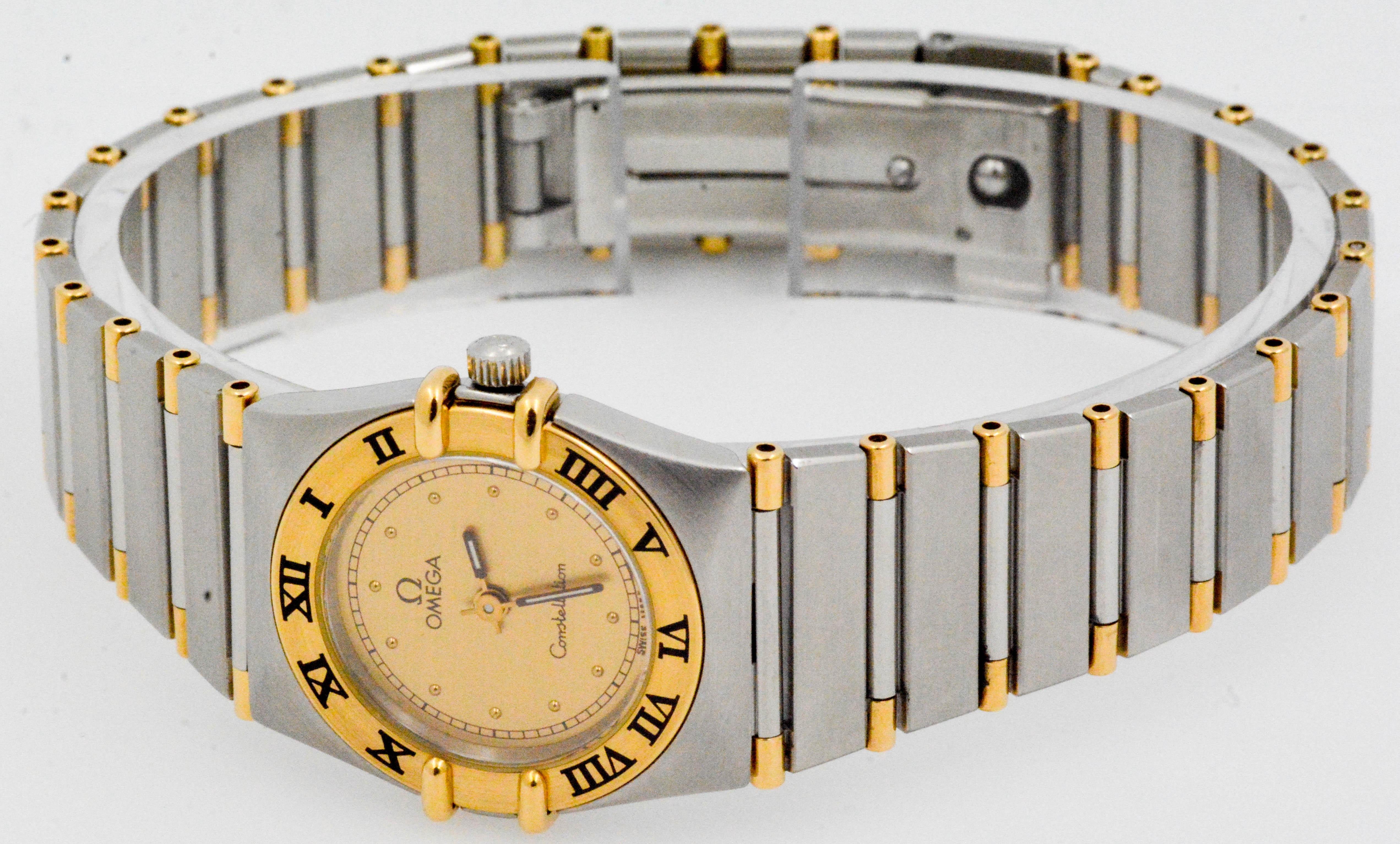 An eye catching Omega two-color wristwatch in stainless steel and 18K yellow gold. This same gold is used for the hands as well as for the polished bars within the stainless steel bracelet. The watch is further distinguished by its iconic