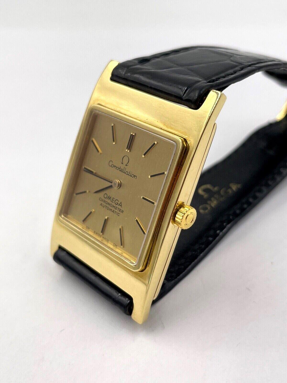 Omega Constellation 18k Yellow Gold Automatic Wristwatch on Omega Black Leather Strap, Circa 1970. 

This vintage Omega Constellation chronometer automatic XL case is in solid 18k yellow gold. This is a great looking watch, very hard to find in this