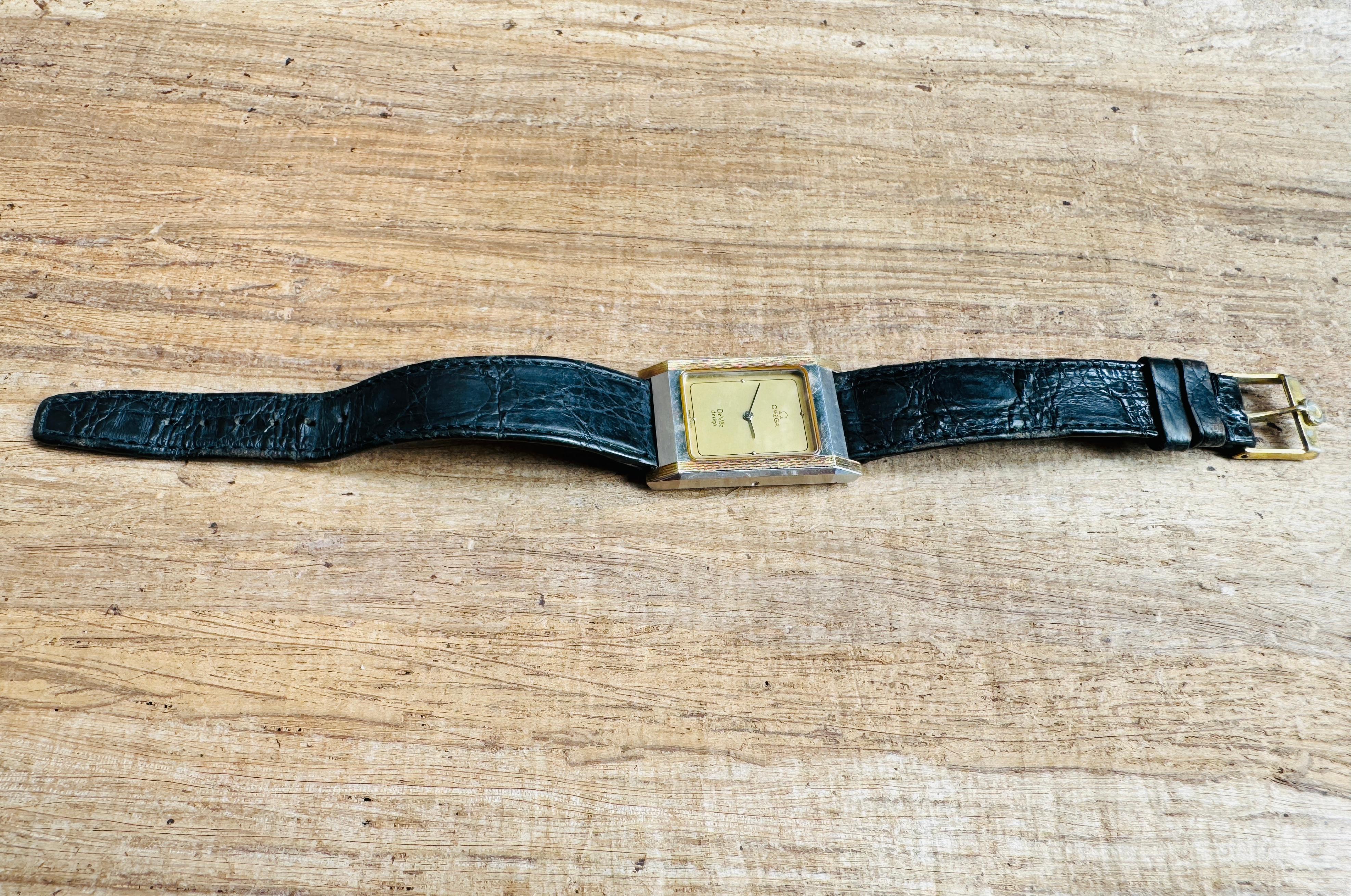  Description
Brand: Omega

Model: De Ville Design

Country Of Manufacture: Switzerland

Movement: Quartz 1387

Case Material: Stainless steel

Measurements : Case width: 25 mm. x 37 mm (without crown)

Band Type : Omega Leather With Marked