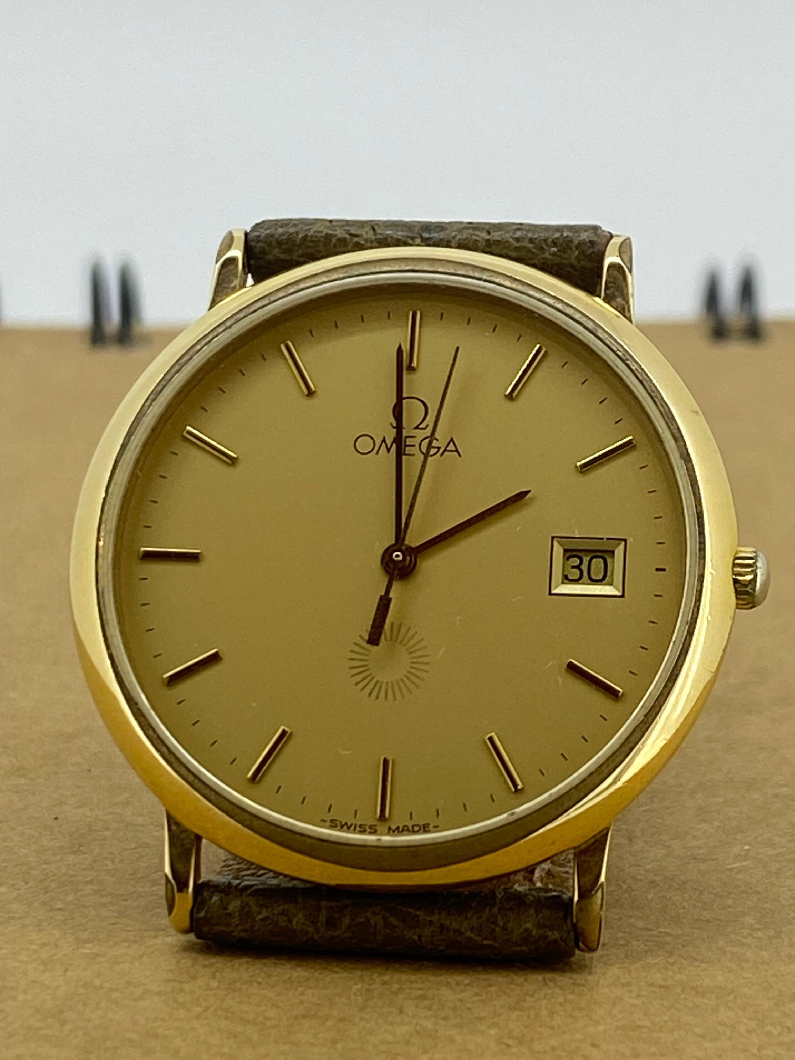 This elegant & versatile c1980’s vintage Omega De Ville watch
features:  

Round S/Steel 18K Gold-Plated Case, 
measuring 32mm, 
Case back is signed & bearing a De Ville logo 

Fitted with Swiss Quartz Movement 

Featuring a desirable & striking