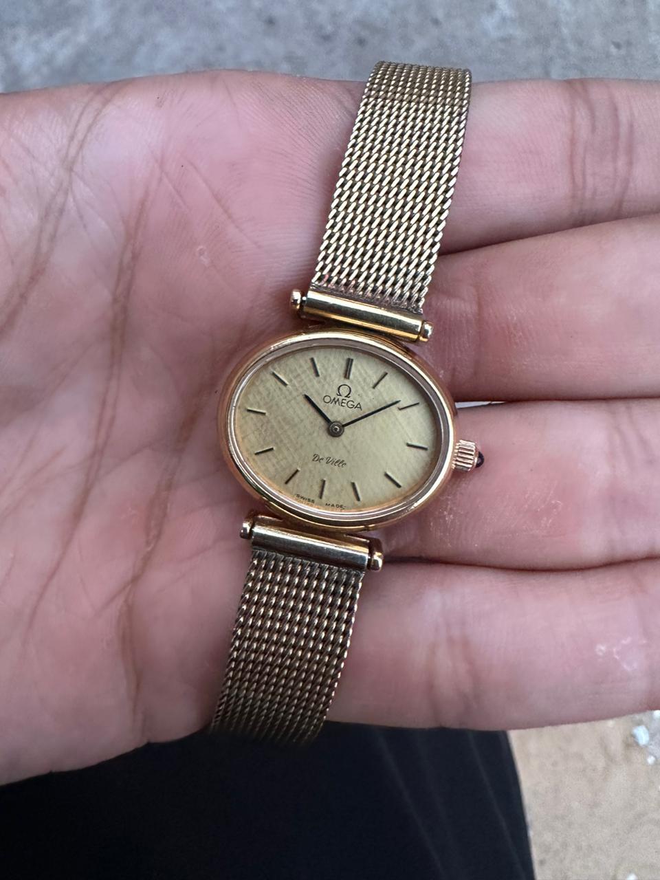Brand: Omega

Model: De Ville

Country Of Manufacture: Switzerland

Movement: Manual Winding 

Case Material: Gold Plated Stainless steel

Measurements : Case width: 25 mm. (without crown)

Band Type : Gold Plated Stainless steel

Band Condition :