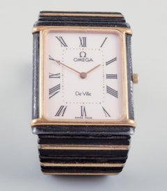 Omega De Ville men's wristwatch in brass and black metal. 1980s.