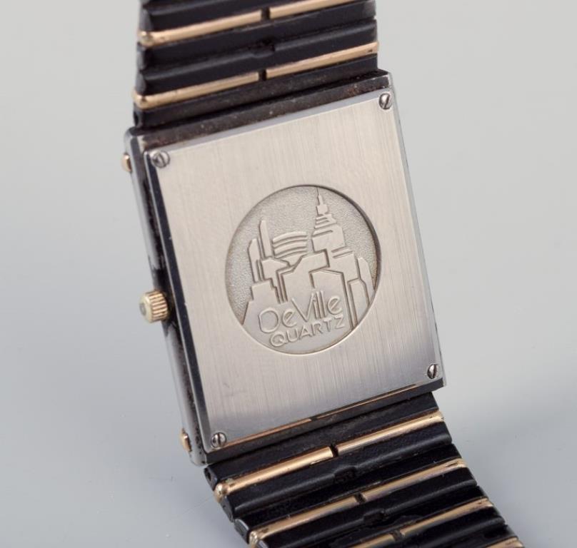 Omega De Ville men's wristwatch in brass and black metal. 1980s. Moderno en venta