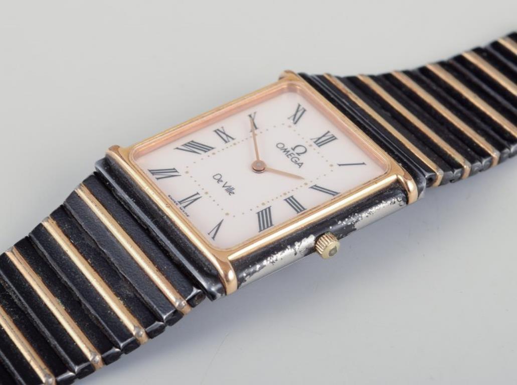 De los hombres Omega De Ville men's wristwatch in brass and black metal. 1980s. en venta