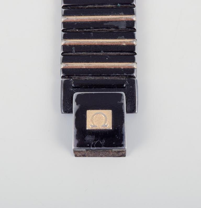 Omega De Ville men's wristwatch in brass and black metal. 1980s. en venta 1