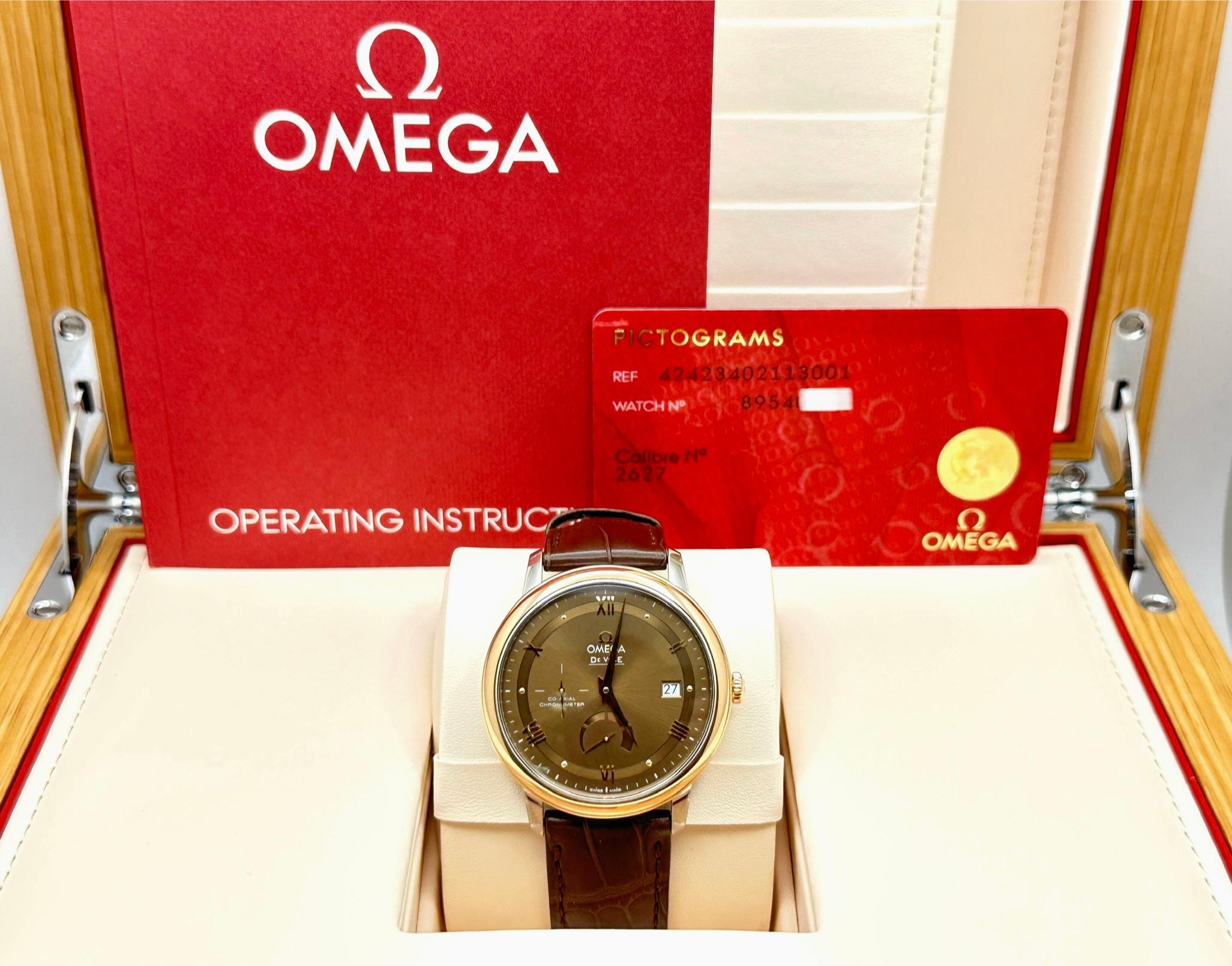 Style Number: 424.23.40.21.13.001

 

Model: Omega De Ville Prestige

 

Case Material: Stainless Steel

 

Band: Brown Leather

 

Bezel: 18K Rose Gold

 

Dial: Brown 

 

Crystal: Sapphire Crystal

 

Case Size: 39.5mm

 

Includes: 

-Omega Box