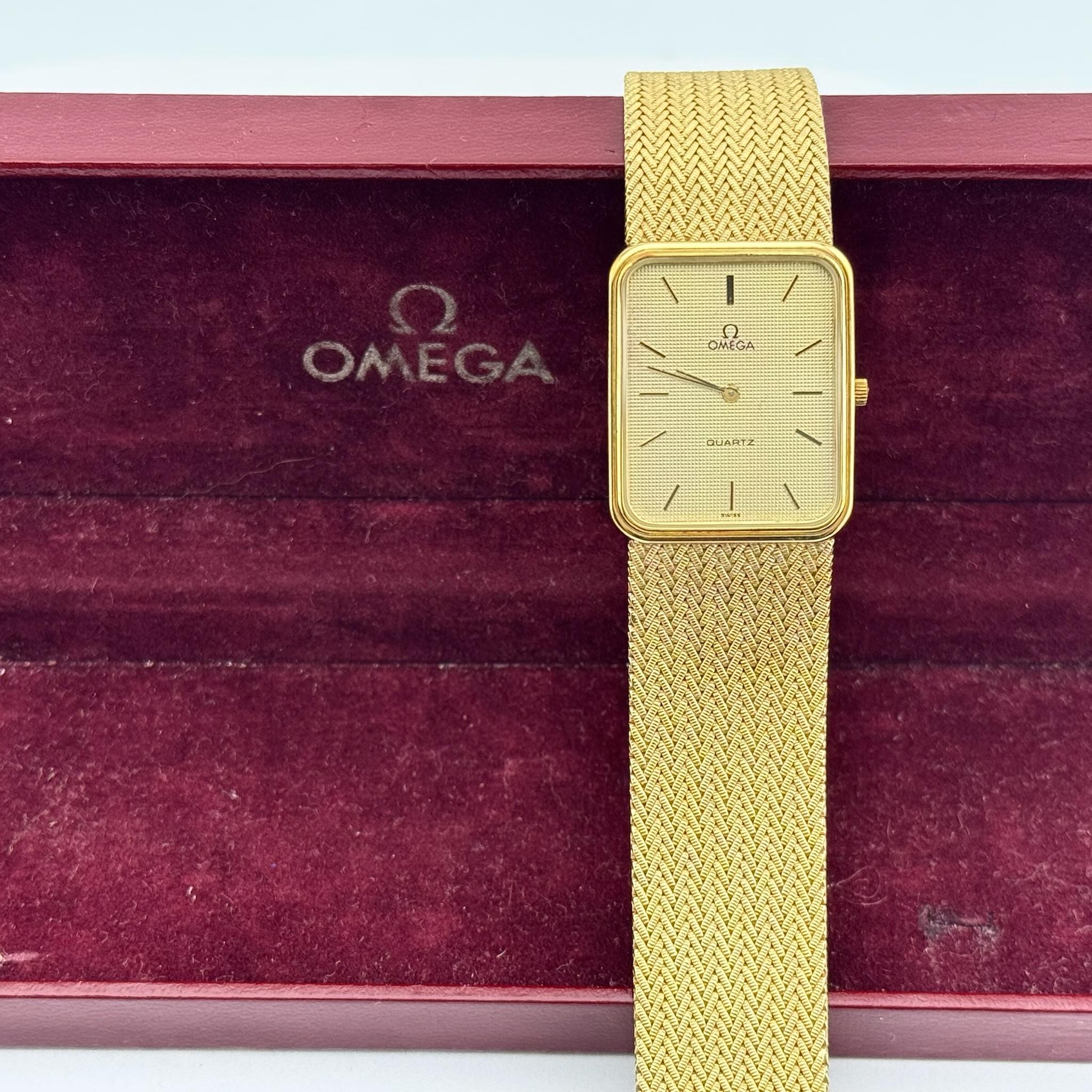Model: OMEGA De Ville Quartz

 

Case Material: 14K Yellow Gold

 

Band: 14K Yellow Gold

 

Bezel: 14K Yellow Gold

 

Dial:  Champagne

 

Crystal: Sapphire Crystal



Case Size: 29mm x 23mm

 

Includes: 

-Original OMEGA Box

-Certified