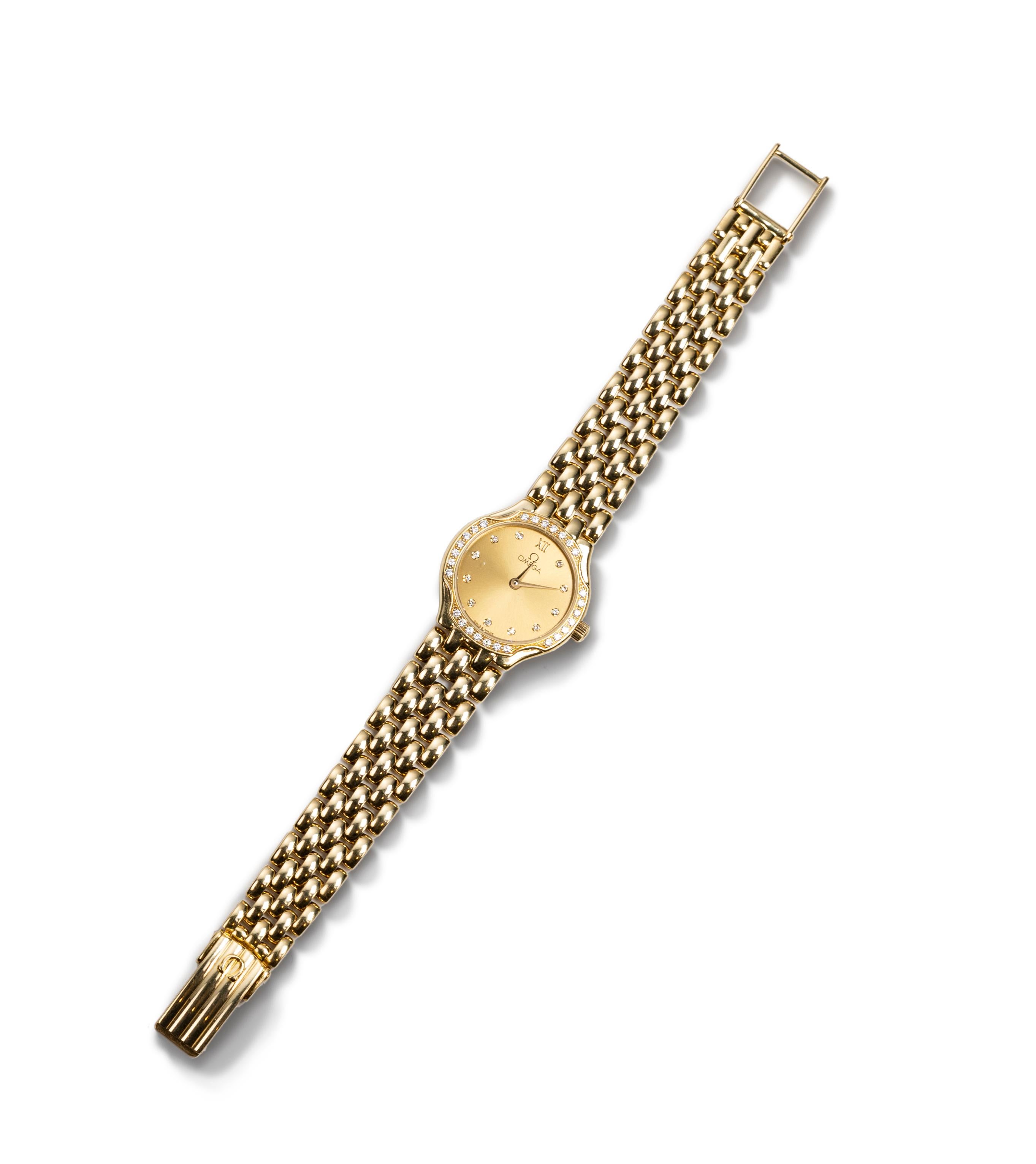 Omega De Ville from the early 90's.  18K yellow gold, quartz, fine white brilliant cut diamonds.  Link style bracelet.  22.5 mm cushion-form case that is very thin.  This watch is in pristine condition.