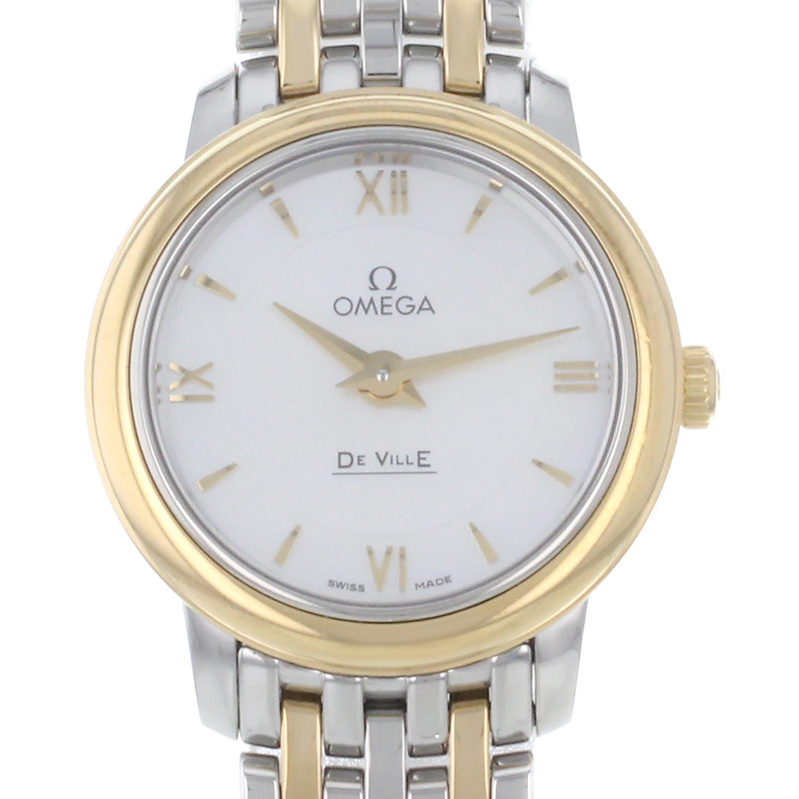This display model Omega DeVille  424.20.24.60.05.001 is a beautiful Ladies timepiece that is powered by a quartz movement which is cased in a stainless & solid gold case. It has a round shape face, no features dial and has hand roman numerals,