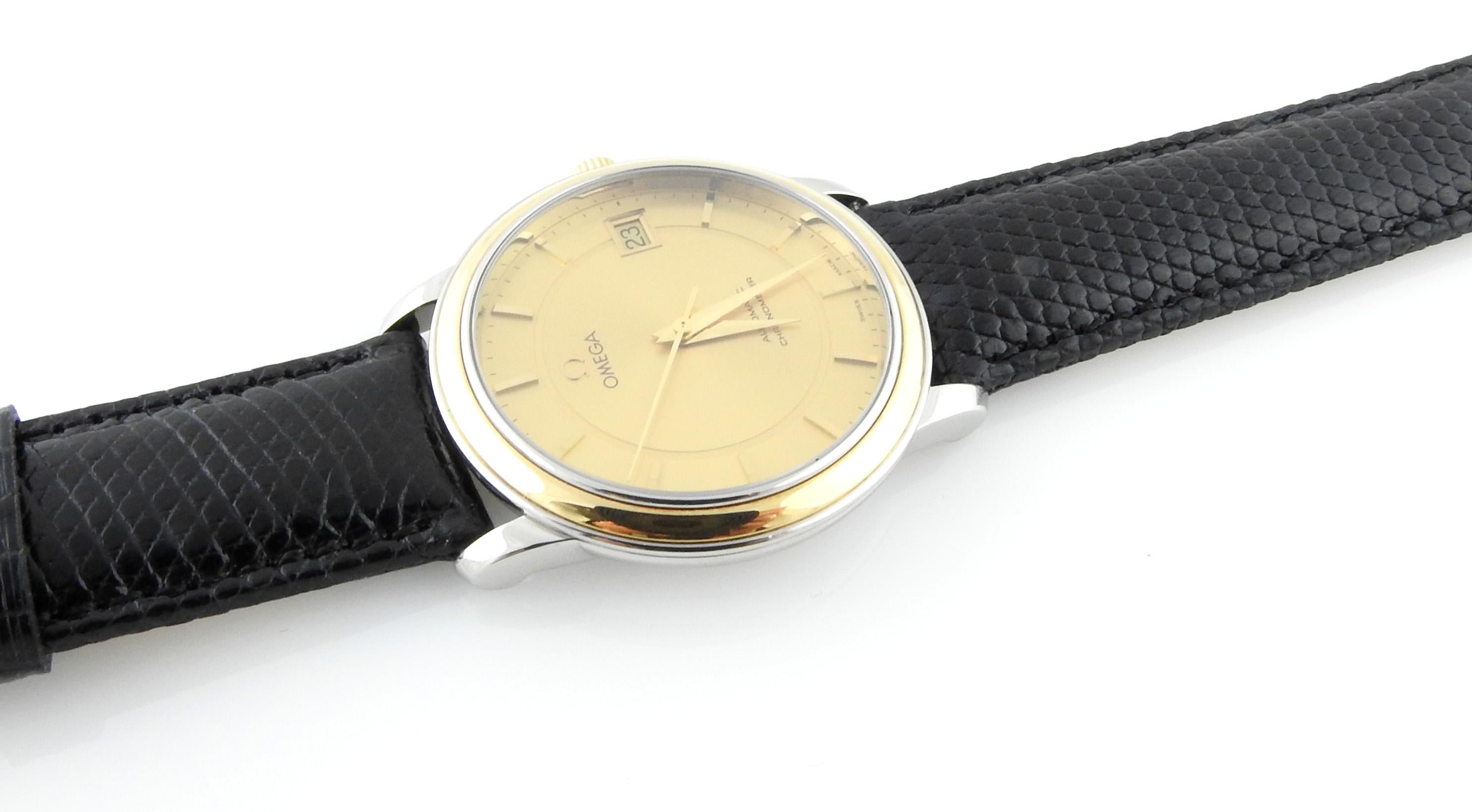 Omega DeVille Prestige Chronometer Men's Watch

This luxury Omega DeVille watch is set with a stainless steel case and 18K yellow gold bezel and crown.

Dial is gold with gold markers

Date at the 3

35 mm case

Automatic movement

Chronometer

New