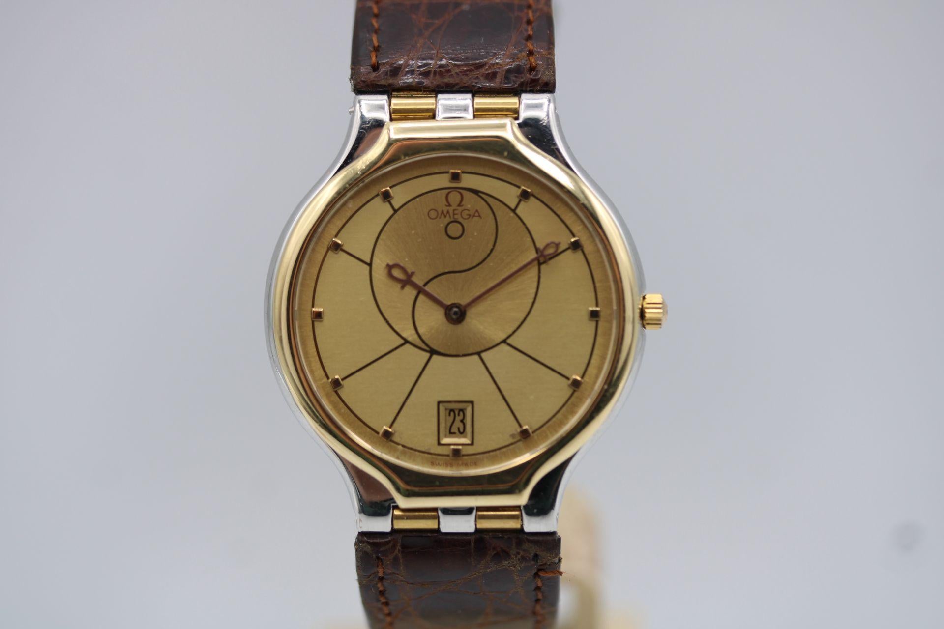 Omega De Ville Symbol “Yin Yang” is an unusual timepiece, with very few around.

This Omega De Ville most eye-catching aspect is its Yin Yang-inspired dial. The gold colour scheme is divided in a flowing, curved manner, mimicking the traditional