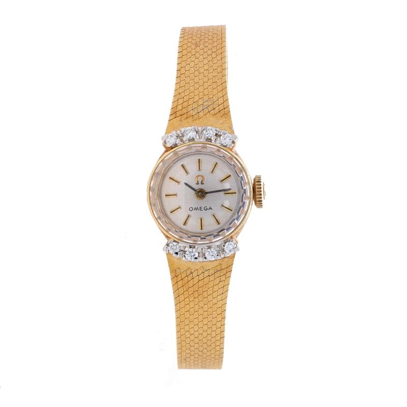 Brand: Omega
Movement: Automatic
Number of Jewels: 17
Warranty: One Year
Year: Vintage
Movement Maker: Swiss
Dial Color: Silver

Metal Content: 14k Yellow Gold & 14k White Gold

Stone Information
Natural Diamonds
Carat(s): .24ctw
Cut: Round