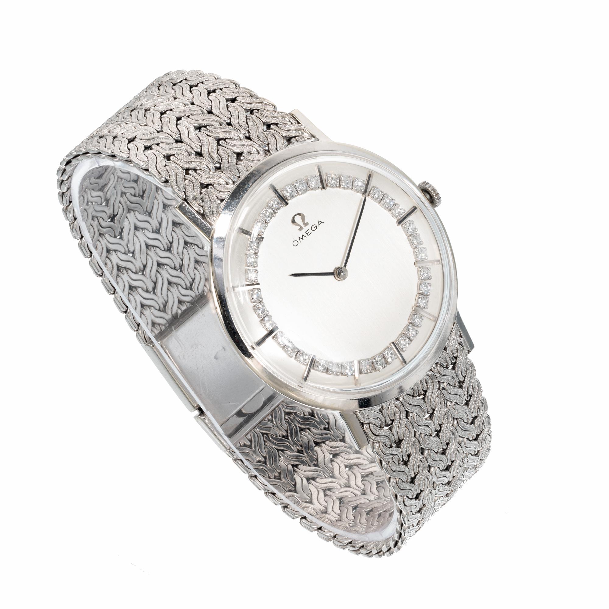 Men's or ladies Omega diamond bezel mesh band wristwatch. Vintage 1960's Omega with a diamond bezel and white gold mesh band. Suitable style and size wise for a man or ladies watch. Can be shortened or lengthened by a professional jeweler. All