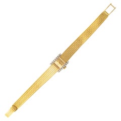 Montre-bracelet Omega en or jaune 18K avec diamants 1970S