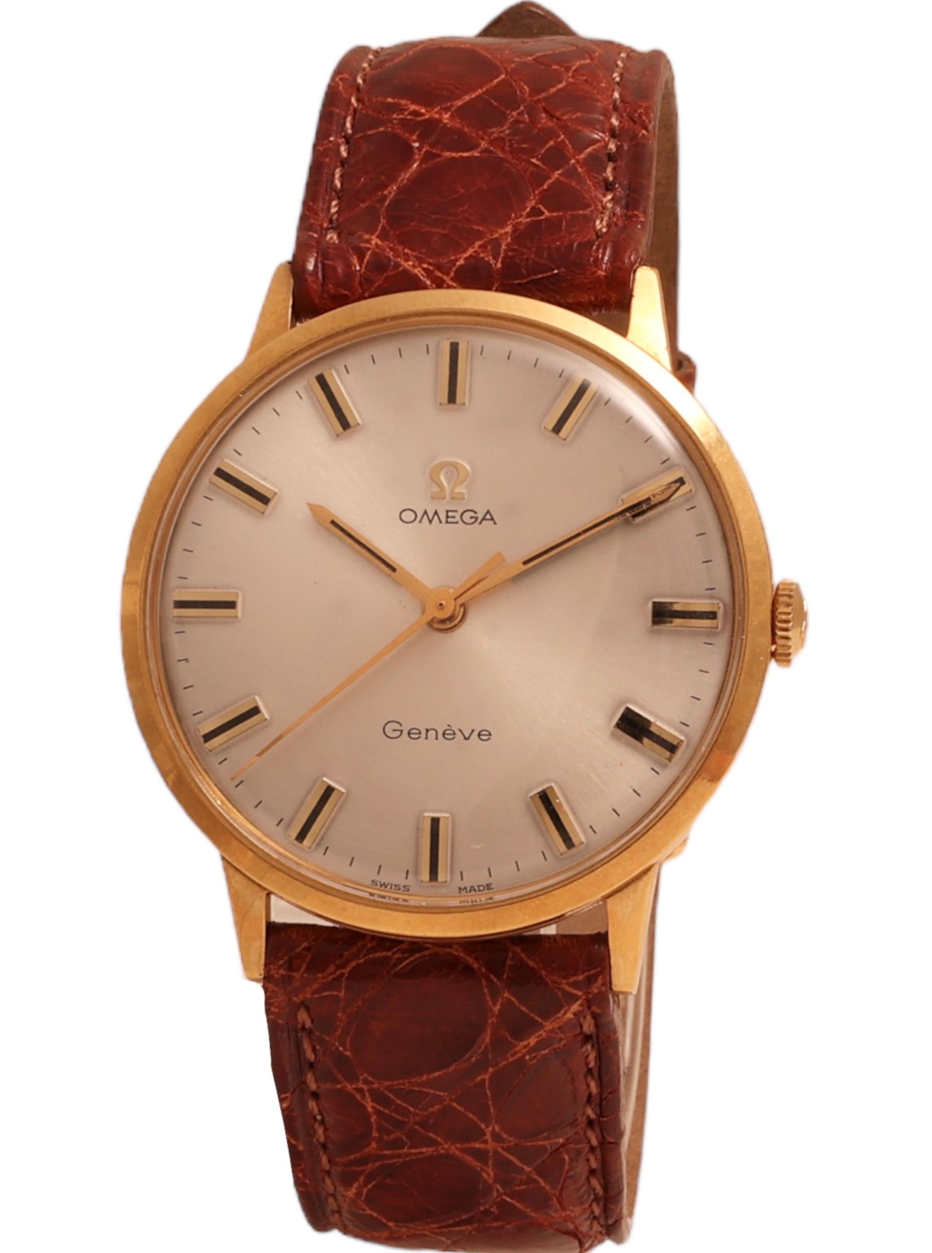 Omega Genève in 18 kt. Yellow Gold Reference 131 041 , Collectors Rare in 18 kt !

Movement: Mechanical Manual Winding Caliber 601 , 17 jewels

Case: 18 kt. Yellow gold case diameter 33 mm x height 7.5 mm 

Dial: Silver dial with golden